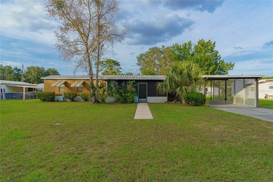 Meticulously maintained, this 2 Bedroom 2 Bath 1992 manufactured home would make a perfect snowbird/retiree home. Offering a spacious 1380 square feet under heat and air and a double lot with just under a quarter acre, theres plenty of space to meet all your needs while staying easy to maintain. The front addition is surrounded by sliding vinyl over screen windows while the back addition features sliding glass over screen windows and a secondary room currently used for storage, although it would make a great office or crafts room. Out back youll find a utility shed with power attached. Notably, there’s no HOA, you own your own lot, taxes are low AND you’re only two blocks away from the local boat ramp providing access to the Withlacoochee River and our very own Lake Panasoffkee! The Town of Lake Panasoffkee offers an A+ Elementary School, Amazing Local Restaurants, and a true spring fed lake that is one of Florida's best hot spots for largemouth bass, bluegill, sunfish, and catfish. Enjoy rural living while being minutes from I-75, allowing easy commute to Orlando, Gainesville, Tampa, and the Villages.