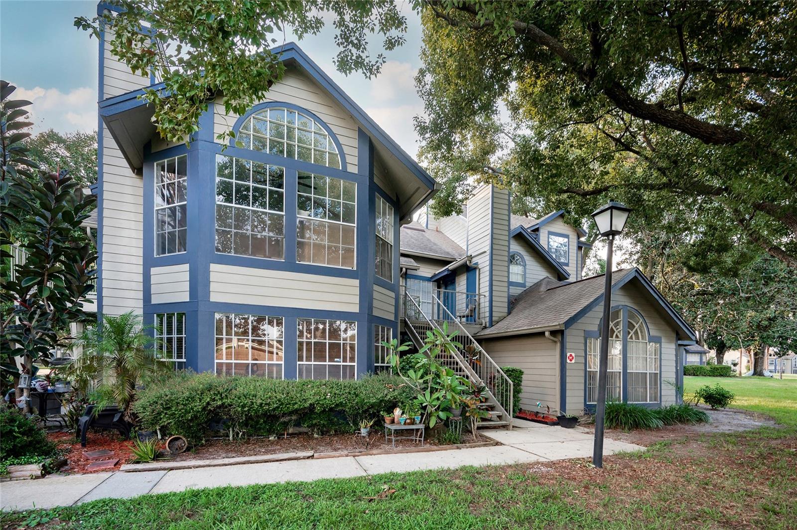 Welcome to Hidden Village in the heart of Lake Mary! This spacious 3-bedroom, 2-bath first floor condo offers 1,142 square feet of light-filled living space with vaulted ceilings and a cozy fireplace that create an open and inviting atmosphere. The unit faces a peaceful green space, adding privacy and a relaxing view. Recent updates include modern vinyl plank flooring throughout.
The generously sized primary bedroom features a roomy double closet and direct access to the en-suite bath. The second bedroom is equally spacious and offers private access to the second full bath, which also serves guests via the hallway. The third bedroom features elegant French doors and makes a perfect guest room, flex space, or a fantastic home office.
Enjoy a well-designed layout perfect for everyday living and entertaining. Conveniently located just minutes from I-4 and Lake Mary Blvd, with top-rated Lake Mary schools and nearby shopping, dining, and parks. This move-in-ready condo is a must-see!