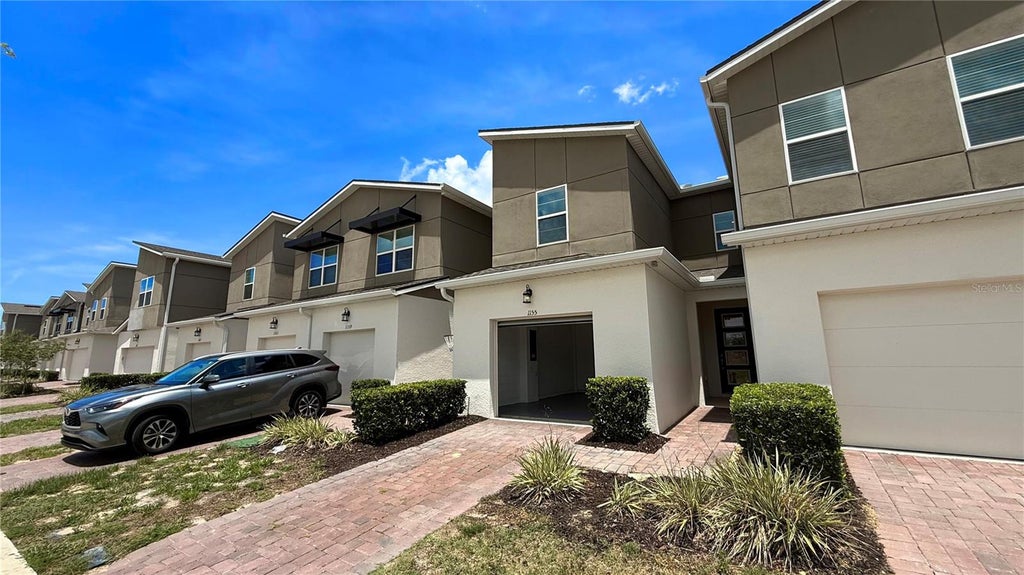 Photo of 1155 Boardwalk Pl #1155, Kissimmee, FL 34747 (MLS # O6427774)