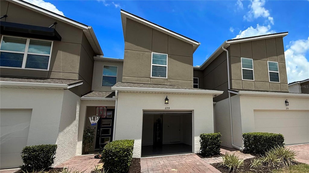 Photo of 1155 Boardwalk Pl #1155, Kissimmee, FL 34747 (MLS # O6427774)