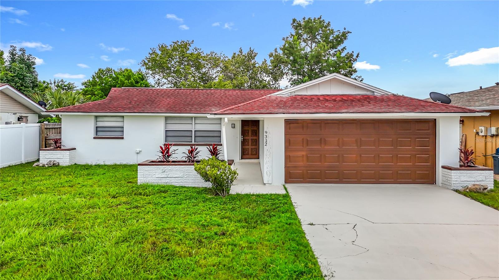 Live the Florida dream in this charming waterfront home! With a 3-bedroom, 2-bathroom split floor plan, this house is designed for family life and entertaining. The updated kitchen is the perfect hub, featuring granite countertops, new appliances, and a convenient snack bar. But the real star is the seamless transition from indoor living space to your private, screened-in pool and covered patio, all with a serene canal view.
Each bedroom offers plenty of storage with built-in closets. With a fresh coat of paint inside and out and a roof replaced in 2011, this home is a fantastic opportunity. It is sold "as-is" with the right to inspect for the seller's convenience.