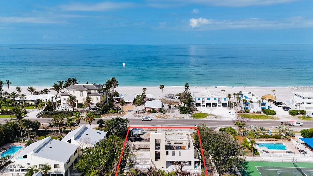 Under Construction. Exceptional Custom Home Opportunity with Unobstructed Gulf Views!
2944 Gulf of Mexico Dr offers a rare and exciting opportunity to own and complete a luxury coastal estate on prestigious Longboat Key. From the third floor and rooftop deck, enjoy beautiful, unobstructed views of the Gulf of Mexico and breathtaking sunset vistas.
The property boasts a prime location with two beach access points just a short 2–3 minute walk away (Access at 2825 Gulf of Mexico Dr near Neptune Ave and 3055 Gulf of Mexico Dr near Triton Bend). This desirable location is also only a quarter mile from Publix and pharmacy, less than one mile from Bay Isles Golf Course and The Longboat Key Club, and just five miles from the world-renowned St. Armands Circle, offering a vibrant mix of fine dining, shopping, and entertainment.
Currently approximately 20% complete (buyer to verify), this residence allows a unique opportunity for the next owner and contractor to bring the approved plans to life. The proposed design features 4 bedrooms, 4 full bathrooms, and 1 powder bath with potentially 4,997 sq ft of heated living area and 10,451 sq ft total under roof, spread across three floors with a stunning rooftop deck.
Additional highlights include two 2-car garage (total fit up to 4 cars), multiple balconies and terraces, and a pre-designed shaft for optional future elevator installation. The home is engineered to meet Florida Building Code 2017 standards.
Heavy construction including the foundation and structural framing has already been started by a licensed builder. The remaining work, final design selections, and permitting are left for the buyer and their builder to customize and complete.
Property is offered as-is, unfinished. Buyer must verify all permits, plans, and finishing requirements with the local jurisdiction prior to closing.
This is an extraordinary chance to create and complete a signature luxury residence in one of Sarasota County’s most sought-after coastal neighborhoods.