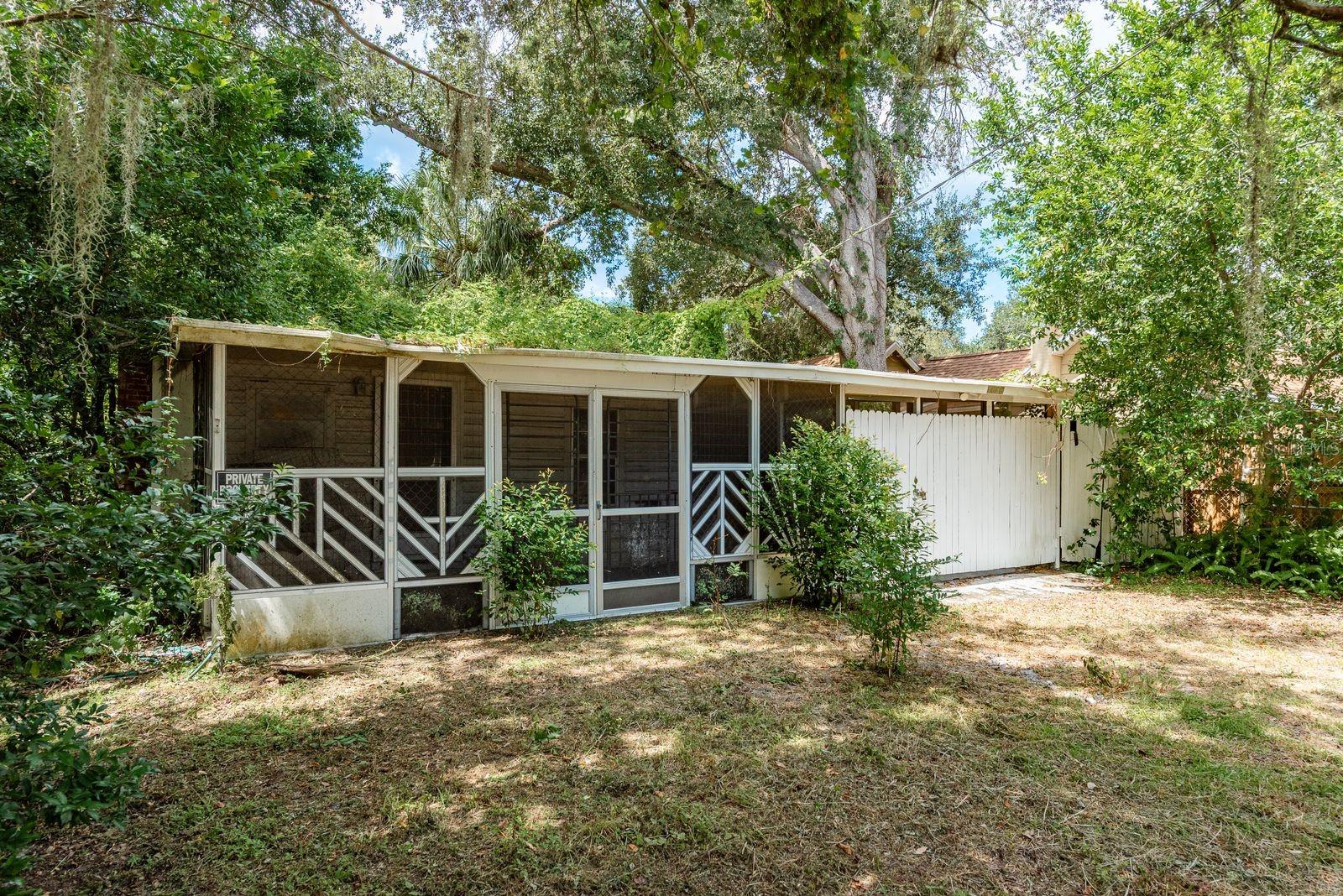 Located between Clearwater and Dunedin, this property presents a rare opportunity in a neighborhood beginning to see new investment and redevelopment. The existing 1-bedroom, 1-bathroom home is in need of a full renovation or demolition, but the true value lies in the land. Set on a .42-acre corner lot, the property features three adjoining parcels, two of which are vacant, creating flexibility for rebuilding, expansion, or entirely new construction. Mature landscaping surrounds the lot, providing a sense of privacy and a sanctuary-like setting, all while being just minutes from Downtown Dunedin and the world-famous beaches of Clearwater. Whether you’re an investor, builder, or visionary, this property offers endless potential in a community with exciting growth on the horizon.