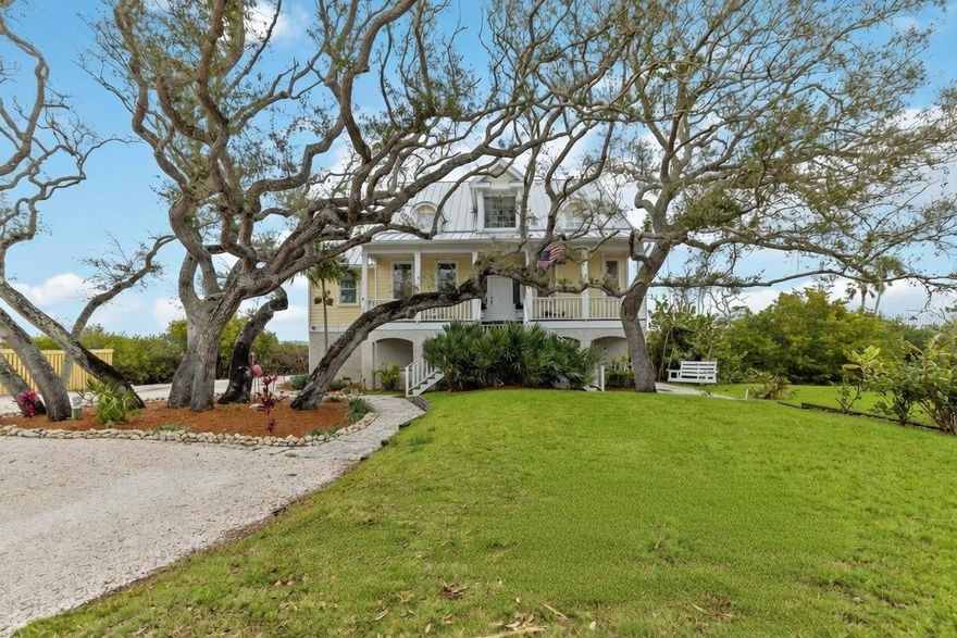 This custom-built coastal retreat offers unparalleled waterfront living with breathtaking views of serene Lemon Bay and exclusive deeded beach access to the Gulf. Designed for ultimate relaxation, the home blends elegance with tranquility, showcasing panoramic views of Florida’s natural beauty, including a stunning live oak tree. Wake up to vibrant sunrises over the bay, enjoy gentle coastal breezes, and listen to the soothing sounds of the water just outside your door.

The interior features spacious living areas, modern amenities, and two beautifully renovated bathrooms, enhancing both comfort and style. Seamless indoor-outdoor living makes the home ideal for entertaining or quiet moments of retreat. Outdoors, enjoy the screened-in lanai or relax in the newly installed backyard pool, creating a private oasis perfect for the Florida lifestyle.

Boaters will appreciate the brand-new dock with a recently installed boat lift, offering direct access to Lemon Bay. Additional updates include a brand-new metal roof (2024) with transferable warranty, refinished wood floors, and new crown molding throughout. Car enthusiasts will love the oversized garage with five parking spaces.

The home is elevated and designed to function as intended during hurricanes, allowing water to flow through the garage while protecting the main living areas. This thoughtful construction enhances durability and long-term peace of mind. A rare opportunity to own a special waterfront property with private beach access to the Gulf—where luxury, resilience, and coastal living come together.
