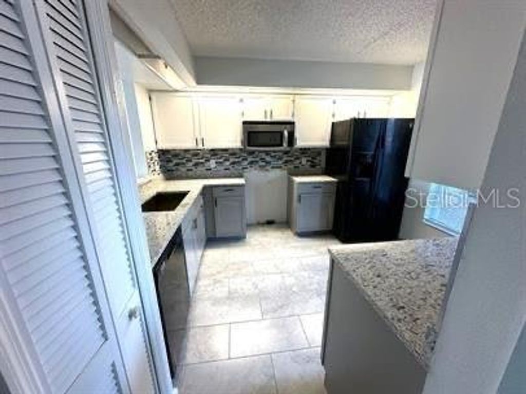 Photo of 13828 Timberbrooke Drive #101, Orlando, FL 32824 (MLS # S5144266)