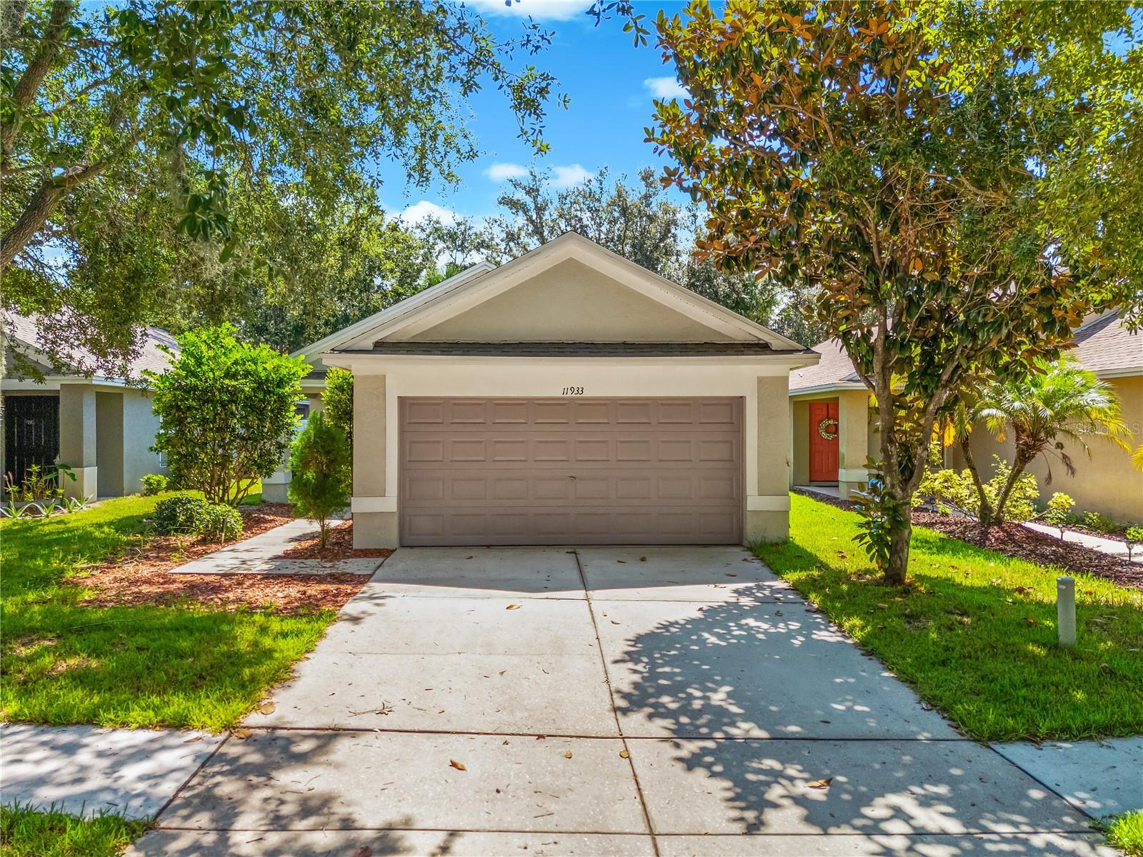 Nestled in a serene neighborhood, this beautifully updated residence blends modern style with everyday convenience. A soothing natural color palette flows throughout the open floor plan, accentuating each living space—all adorned with durable luxury vinyl flooring, creating an inviting atmosphere from the moment you step inside. The generous primary suite boasts a spacious walk-in closet and a bath with abundant under-sink storage. Here you can retreat to your spa-inspired primary bath, complete with a frameless, walk-in glass shower - an oasis of relaxation after a long day. The additional rooms present versatile layouts ideal for a home office, guest quarters, or play area and the second bath features a deep, soaking tub. Step outside to discover a fully fenced backyard where privacy and peace of mind await, complete with a covered, screened patio perfect for al fresco dining and a cozy fire pit for evening gatherings. The seller invested over $35,000 in a comprehensive kitchen with new appliances, and flooring renovation, elevating both functionality and style. Other recent improvements include a brand-new roof installed in 2023 and fresh interior and exterior paint—ensure lasting value and immediate move-in readiness. Experience the comfort and sophistication this home delivers; schedule your private tour today.