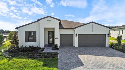 Photo of 442 Turin Way, Lady Lake, FL 32159 (MLS # W7886348)