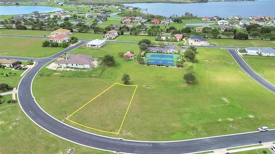 Nestled within the sought-after community of Water Ridge in Lake Alfred, FL, this .29-acre lot offers the perfect canvas to design your dream home in a picturesque, resort-style setting. Cleared and buildable, this lot features lovely views out to a green space at the back of the property. Water Ridge is a gated, HOA-managed neighborhood that blends natural beauty with luxury living. Residents enjoy an impressive array of upscale amenities, including three resort-style swimming pools, a state-of-the-art fitness center, four lighted tennis courts, a luxurious clubhouse, and scenic walking trails that wind through the community’s lush landscapes. For boating and fishing enthusiasts, exclusive private lake access provides endless opportunities to explore the sparkling waters, while the onsite boat and RV storage ensures easy access to outdoor adventures. This prime location offers the perfect balance of tranquility and convenience, with major highways nearby allowing for effortless travel to Orlando, Tampa, and surrounding areas. A short drive leads to world-famous attractions such as Disney World and Legoland, as well as vibrant shopping, dining, and entertainment hubs. Don't miss this incredible opportunity to build your dream home in a community that offers the perfect blend of luxury, nature, and convenience!