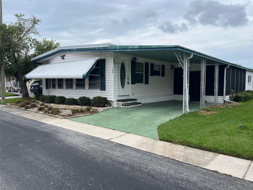 Palm Hill Country Club, a five-star mobile home park, is the community chosen time after time to be a permanent or seasonal residence for the 55 and over population. The reason this park is picked to be home by so many is its location within the Tampa Bay area, as well as it's extensive amenities like golf, swimming pools and jacuzzis, tennis courts, bocce courts, shuffleboard courts, billiards rooms, horseshoes and pickleball court. As if this isn't enough, for a monthly $554.00 maintenance fee, you will be provided water, sewer, garbage, lawn care, cable and internet. This recently listed 2-bedroom, 2 bathroom,1296 sq ft property is just the way to be introduced to such an exceptional area!

INTERIOR:
Looking for a blank slate? This could be the one!  In this spacious, fully furnished residence you will discover an expansive floor plan that integrates vinyl and carpet flooring, while updated windows ensure ample natural light throughout the home. Central heating and air (2020), ceiling fans, and ceiling ducts provide consistent climate control year-round. The kitchen is equipped with major appliances, including a dishwasher and disposal, and  connects to a designated dining area and open living space. The primary bedroom offers generous proportions, two closets, and a private ensuite featuring a walk-in shower. A well-sized guest bedroom is complemented by an adjacent bathroom with a shower/tub combination and a long vanity offering additional storage.
EXTERIOR:
Simple, straightforward, and ready for your ideas would be the way to describe the exterior of this home. Vinyl siding and awnings provide shade, while the lowered Florida room creates a relaxed space perfect for indoor/outdoor living or entertaining friends and family. A roof-over is currently in place but will need replacement—something to consider as you make it your own. You'll find a shed that houses the washer and dryer, adding extra utility to this easygoing setup.  Priced accordingly at $75,000, including a share, allows for a solid start in a great community.  Here’s a place with potential—and a price to match!