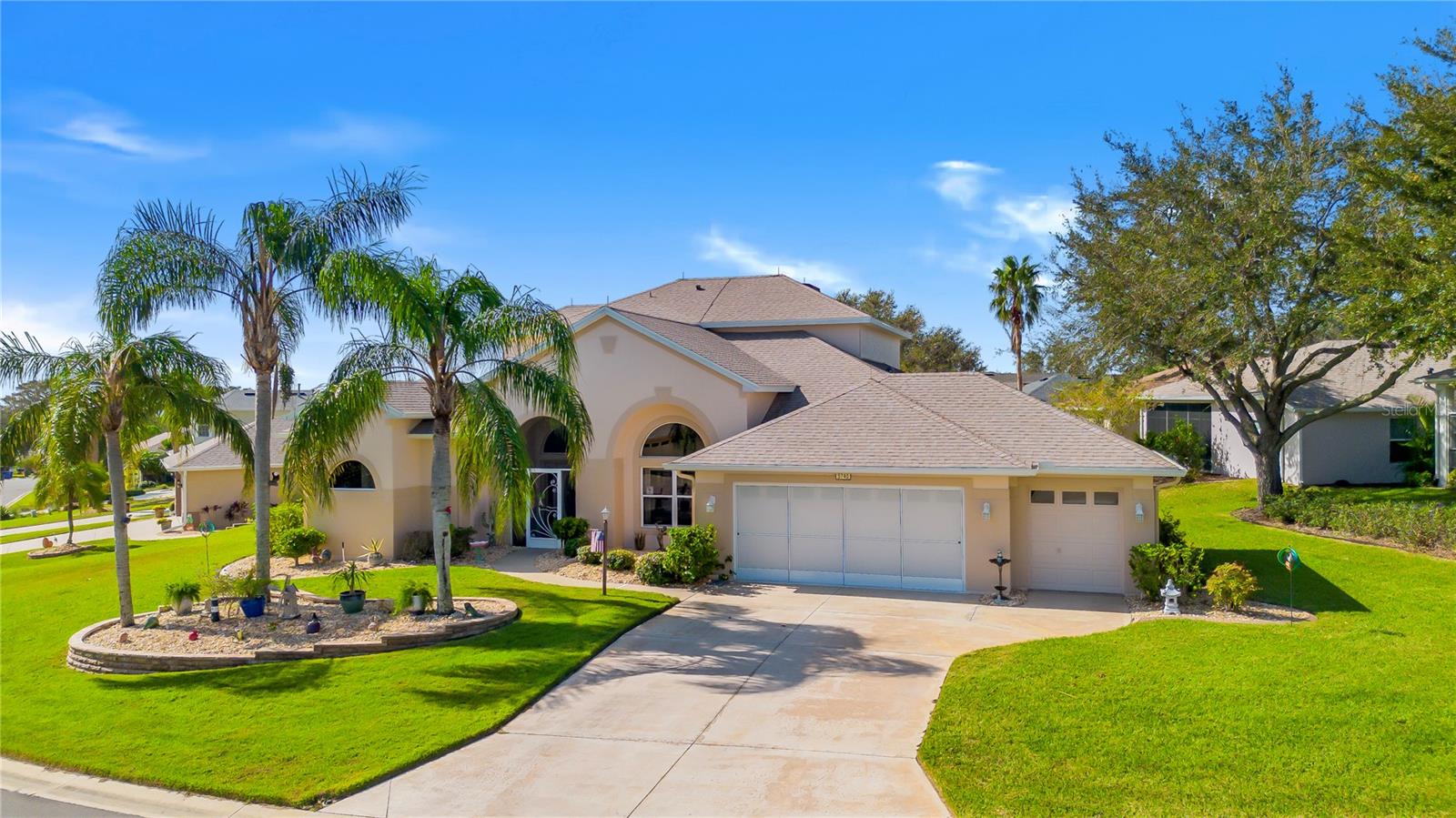 This beautiful home captures the essence of Florida living in beautiful Tavares, the Seaplane Capital. From the moment you arrive, the meticulously landscaped yard welcomes you. Inside, the floor plan offers a living room and dining room combination which is perfect for entertaining. The living room opens to an enclosed lanai inviting you to enjoy indoor-outdoor living at its finest. The split floor plan includes a master suite, with its own access to the lanai and room for a reading nook or office. The master bath features a walk-in shower, double sinks, handicap accessible and a spa-like atmosphere. The upgraded kitchen opens to the family room with a beautiful stone accent wall. Off the family area are two additional bedrooms and a guest bathroom with a solar tube skylight. Upstairs, the fourth bedroom and bonus room provide endless possibilities. With panoramic lake views, the bedroom boasts two closets and a bonus area complete with a wet bar and bathroom. This area can serve as a game room, exercise room, craft room, man cave, or even a guest suite. The AC was replaced in October 2024 with three separate zones. Large driveway with an over-sized two-car garage, golf cart garage and plenty of parking and storage space. Royal Harbor is a gated 55 plus golf cart community offering residents access to a storage area for boats, RVs, and other recreational vehicles. Amenities include an Olympic-size enclosed pool, pickle ball and tennis courts, and a clubhouse featuring a gym, craft rooms, library and a billiards room.