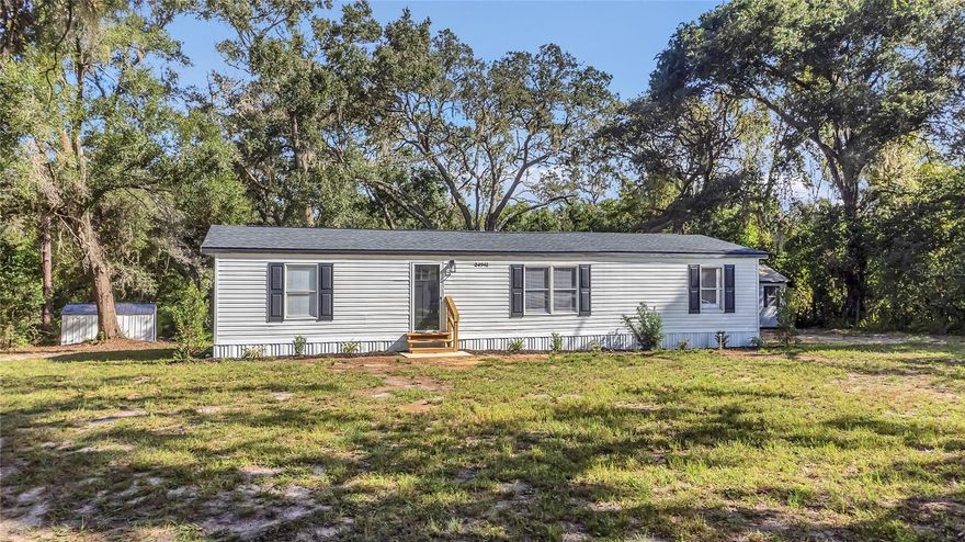 Beautiful 3 Bedroom, 2 Bathroom home on Over a Half Acre with No HOA and COMPLETELY REMODELED with NEW EVERYTHING!!!  This was a fully permitted remodel!  The remodel included a new roof, new AC system, full new septic system, new electrical, new plumbing, new hot water heater, new drywall, new kitchen with stainless appliances and quartz counter tops, new glamour bathrooms with high end custom finishes, new Luxury Vinyl Plank floors throughout, new hardware and fixtures throughout, new insulation, new landscaping, new front and back porches and much much more!   The property features an open floorplan and lots of natural light.   The master bedroom is a true suite with high end bathroom finishes and a large closet.  There is a full indoor laundry room.   There is a huge front hard and massive backyard covered by a beautiful canopy of mature oaks provide plenty of open space and shade.  There is also a large workshop on the property with a metal roof and an additonal shed and a pole barn.  The property is located on a quiet culdesac.   There was NOT any flood damage or flooding at the property and the home is NOT in a flood zone!!!!   ***ELIGIBLE FOR ALL FINANCING TYPES*** Including FHA, VA, Conventional, and USDA.  The home has also been inspected ad brought up to current building codes for hurricane tie downs and piers and has received a full engineering certification making it ready for inspections and financing.  This property is also on public water and does not have a well which is a rare and major benefit for a rural property!!!