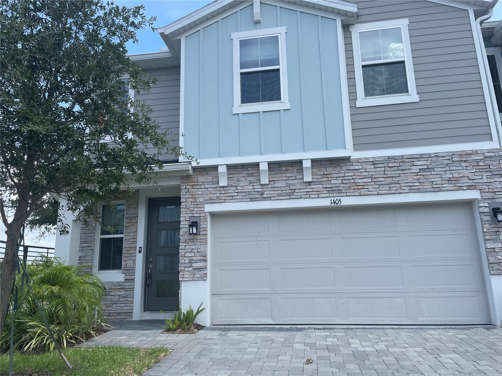 A BEAUTIFUL 4-bedroom, 2-bathroom END UNIT townhome in the spectacular gated community of River's Edge! A beautiful place to call home! This community is located in the heart of Sanford in the desirable Seminole County. This gorgeous two-story townhome is beautifully designed and offers a modern feel throughout! The 8ft entrance door with exquisite glass panels makes for an amazing entrance for all of your guests! Tile flooring throughout all living areas on the 1st level of the home. The kitchen is equipped with stone counters, stainless steel appliances, ample cabinet space, kitchen panty and breakfast bar which is perfect for entertaining guests! All 4 bedrooms including the master are located on the 2nd level. All bedrooms are very spacious and include overhead lighting, generous closet space and plush carpet! The master bathroom features modern fixtures with dual vanity and shower stall. The additional bathrooms are very modern as well with tile flooring and neutral colors. The laundry room closet is on the 2nd level for added convenience and includes both a washer, dryer and wire shelving. The home includes an attached 2-car garage and beautifully paved driveway. The community itself has exceptional craftsmanship and offers walking trails, playground and beautiful conservations areas for relaxation. Enjoy the short distance to Sanford Riverwalk and just minutes away from the Historic Downtown Sanford which offers shopping, dining, world class entertainment and so much more!