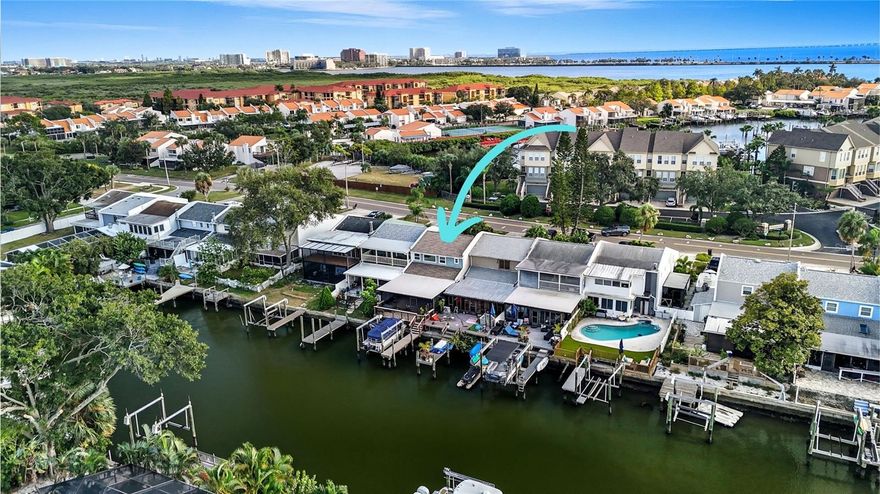 Do you love boating, kayaking, paddle boarding or watching dolphins and manatees from your backyard?  Then this is the house for you!  Discover refined waterfront living in this impeccably maintained home, located in the highly desirable Bay Crest community — a hidden gem offering direct access to Tampa Bay with no HOA, CDD, or deed restrictions. This elegant residence spans over 1,700 square feet and features three spacious bedrooms, two and a half bathrooms, and a collection of thoughtfully curated upgrades designed for both comfort and style.

The exterior welcomes you with a paver driveway, a fenced front walkway, and a new roof (2023), setting the tone for the quality and care found throughout. Inside, tile flooring extends across an open-concept layout ideal for entertaining. The chef’s kitchen serves as the centerpiece, offering a large island with granite countertops, abundant cabinetry, a large walk-in pantry, and stainless-steel appliances—all seamlessly connecting to the living and dining areas, each overlooking serene water views.

The attached one-car garage has been fully insulated and converted into a climate-controlled flex space, perfect for a media room, studio, gym, or home office, adding another 300 sq feet of living space or climate-controlled storage, for a total of 2030 sq feet of living space. Upstairs, the spacious primary suite easily accommodates a king-sized bed and features dual closets, while the secondary bedrooms include generous storage and plenty of room for guests. The convenient upstairs laundry, double linen closets, and additional under-stair storage make daily living exceptionally functional.

Outdoor living shines with a covered screened-in porch ideal for outdoor dining or sunset relaxation, leading to a private dock and boat lift. From here, you can reach open bay waters within minutes, embracing the true Florida boating lifestyle. 

Bay Crest residents enjoy a relaxed waterfront lifestyle complete with a private community boat ramp, neighborhood gatherings, and annual events such as the Christmas boat parade. Located just minutes from Tampa International Airport, downtown Tampa, Raymond James Stadium, fine dining, shopping, and award-winning Gulf beaches, this residence combines the best of waterfront living with exceptional convenience.

Offering elegance, privacy, and modern upgrades in one of Tampa’s most accessible boating communities, this home presents a rare opportunity to experience Florida living at its finest.