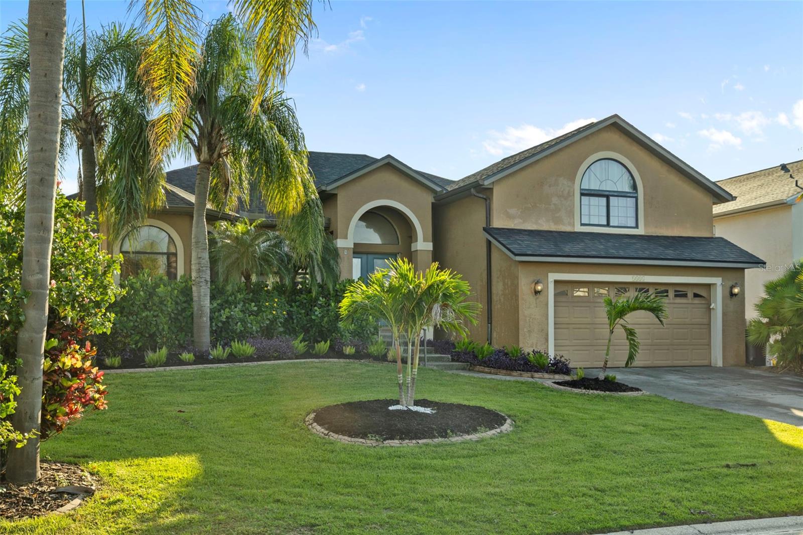 Located in the sought-after Dolphin Cove neighborhood of Apollo Beach, this fully furnished 3-bedroom, 3-bath pool home sits on one of the highest elevations in Apollo Beach—approximately 11 feet above sea level—and remained high and dry during last year’s storms. Tucked along a deep-water canal with direct access to Tampa Bay, this home offers the ideal blend of coastal living and spacious comfort. Currently operating as a successful short-term rental, it’s equally suited as a full-time residence or turn-key investment. Step inside to a large, open-concept living area that flows into an extended entertaining space, where expansive sliding glass doors invite the outdoors in. Natural light pours through, illuminating the beautifully screened-in pool, spa, and patio—perfect for year-round relaxation. A thoughtful split floor plan offers privacy, with the primary suite separated from the downstairs bedroom. Upstairs, a spacious third bedroom with its own ensuite provides a private retreat for guests, extended family, or an office. Outside, enjoy a 10,000 lb boat lift and private dock—just minutes from open water. Whether you’re heading out for sunset cruises or weekend fishing trips, this home was made for life on the water. Located near the Apollo Beach Preserve and convenient to Hwy 41, I-75, and 301, this property is a rare find: elevated, spacious, and ready to enjoy.