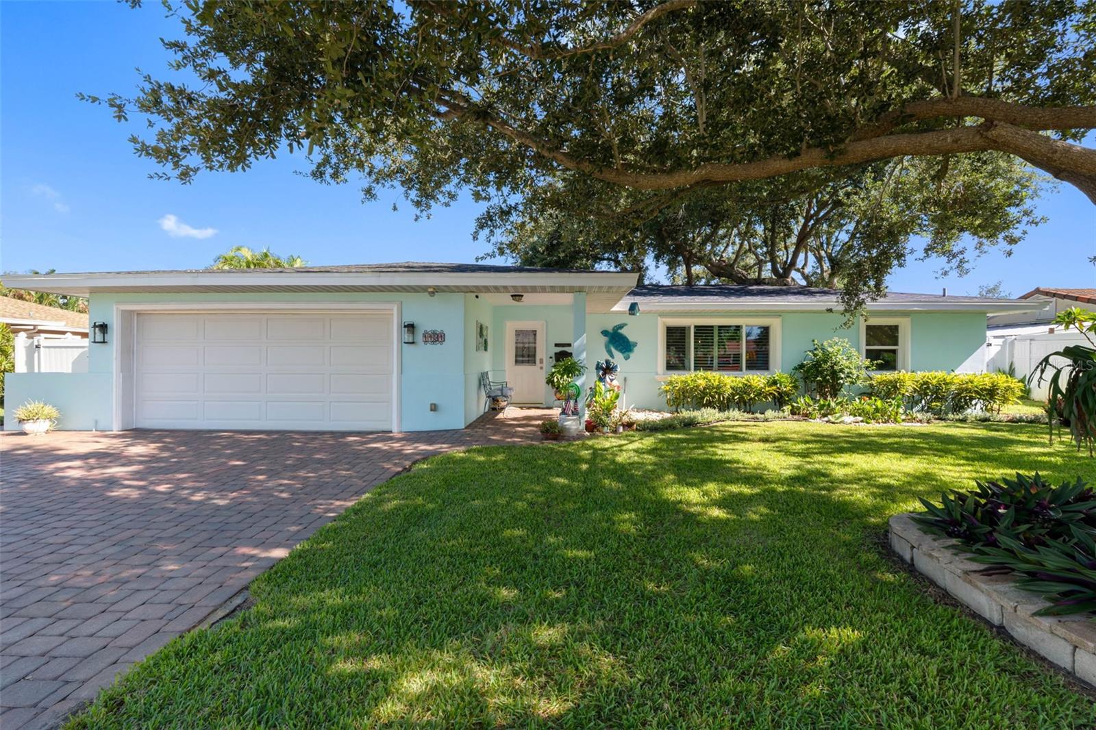 Discover the perfect blend of privacy, luxury, functionality, and durability in this stunning waterfront home—designed for effortless living and built to last. And here's the best part: This home sustained ZERO DAMAGE from flooding or wind during the 2024 hurricane season, offering peace of mind in a tranquil coastal setting. With an extensive list of thoughtful upgrades and a prime location on a quiet canal with a completely undisturbed view of lush mangroves and direct access to Tampa Bay, this property offers the ultimate Florida lifestyle.
The pool and spa (2014) create a resort-style oasis, complemented by a natural gas outdoor kitchen (2020)—ideal for entertaining year-round. Recent upgrades include new raised sea wall (2020) and a gas Hayward spa/pool heater.
Inside, the home shines with a fully renovated kitchen (2019) featuring modern cabinetry and countertops, paired with high-end appliances including a French door LG refrigerator (2021), GE Profile gas stove, and new GE dishwasher (2025). Natural light floods the living space through newly replaced windows (2021), including a dramatic picture window in the living room.
Additional features include:
New shingle roof (2019) and flat roof (2025),
Gas tankless water heater (2021),
Lennox A/C with gas furnace (2023),
Updated ductwork and insulation (2019),
8x10 Tuff Shed and boat trailer pad (2021), and
Security system.
Enjoy direct water access from your private dock, featuring composite decking, a fish cleaning station, and a Hi-Tide 9,000 lb aluminum gear drive boat lift with remote control (2013). Whether you're boating, fishing, or simply relaxing by the water, this setup is ready for your next adventure.
With its luxurious amenities, this home is more than move-in ready—it’s move-in exceptional. Come experience waterfront living at its finest.