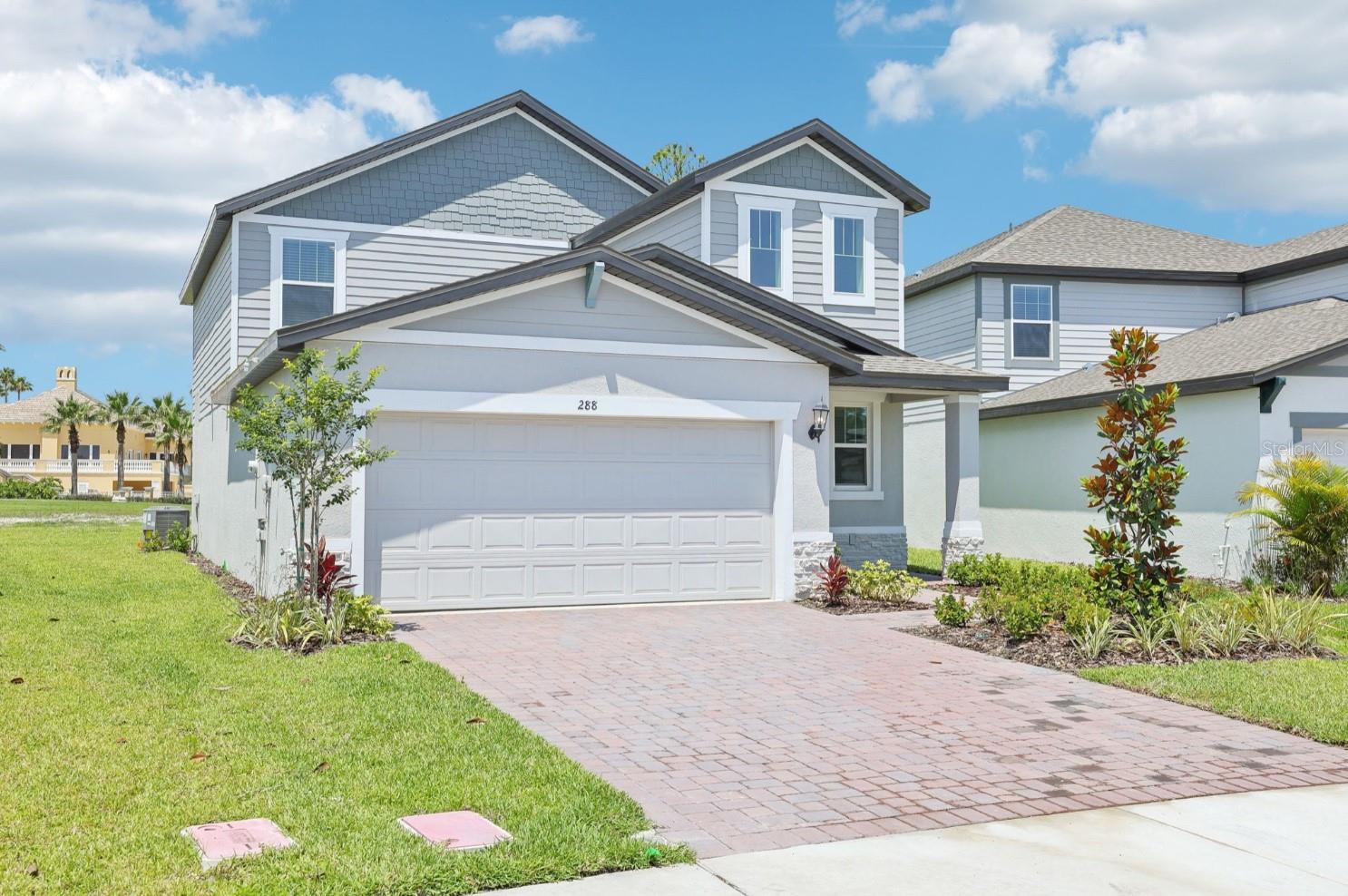 One or more photo(s) has been virtually staged. The Yellowstone floor plan by Meritage Homes, located in the vibrant Links Terrace community of Daytona Beach, is now available for quick move-in. Designed with flexibility in mind, this home accommodates growing families or offers comfortable multi-generational living. Spanning two stories, it features an open-concept great room that flows effortlessly into a chef-inspired kitchen and casual dining area, perfect for entertaining or everyday family gatherings. The layout includes a downstairs primary suite for added convenience and privacy, while upstairs boasts an inviting loft space that can adapt to your family’s needs—be it a playroom, media area, or home office—alongside additional bedrooms.
Crafted with energy efficiency at its core, this home comes equipped with high-performance appliances, integrated blinds throughout, spray-foam insulation, and Meritage’s Green Building technologies, resulting in reduced utility costs and year-round comfort. A state-of-the-art smart home system puts control of lighting, HVAC, security, and more right at your fingertips, ensuring modern convenience and peace of mind.
Links Terrace offers a sought-after lifestyle within a true golf community, adjacent to LPGA International. Residents enjoy easy access to top-tier shopping, a variety of dining options, and major roadways like I-4 and I-95. With only a short drive to Daytona Beach’s famous shores, this home perfectly balances daily convenience and coastal leisure. The community features parks, trails, resort-style pools, fitness facilities, playgrounds, and regular neighborhood events—providing a welcoming atmosphere for all ages.
This energy-efficient, smart-enabled Yellowstone in Links Terrace offers true generational living potential, versatile space for a growing household, and the prestige of a quality golf community—truly a perfect place to call home.
