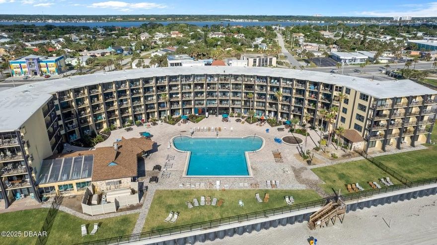 Charming oceanfront studio with newer impact windows and stunning views of the Atlantic. Lovingly used as an owner’s retreat, this unit is in excellent condition and thoughtfully updated throughout. The space features a high-quality king-size bed, two comfortable recliners, attractive tile flooring, a convenient kitchenette, and tasteful finishes that make it both inviting and functional. Offered fully furnished, it’s truly turn-key—ideal as a weekend escape, vacation retreat, or income-producing condo.

The Hawaiian Inn is a beloved, iconic beachfront destination that has welcomed generations of returning guests. Enjoy the on-site tiki bar known for great burgers, fish sandwiches, and ice-cold drinks, unwind by the large oceanfront pool, or relax year-round in the heated indoor pool. The welcoming lobby includes a gift shop and game room, adding to the classic resort-style experience. Perfectly located near the Speedway, shopping, and dining, this is a rare opportunity to own your own slice of oceanfront paradise.