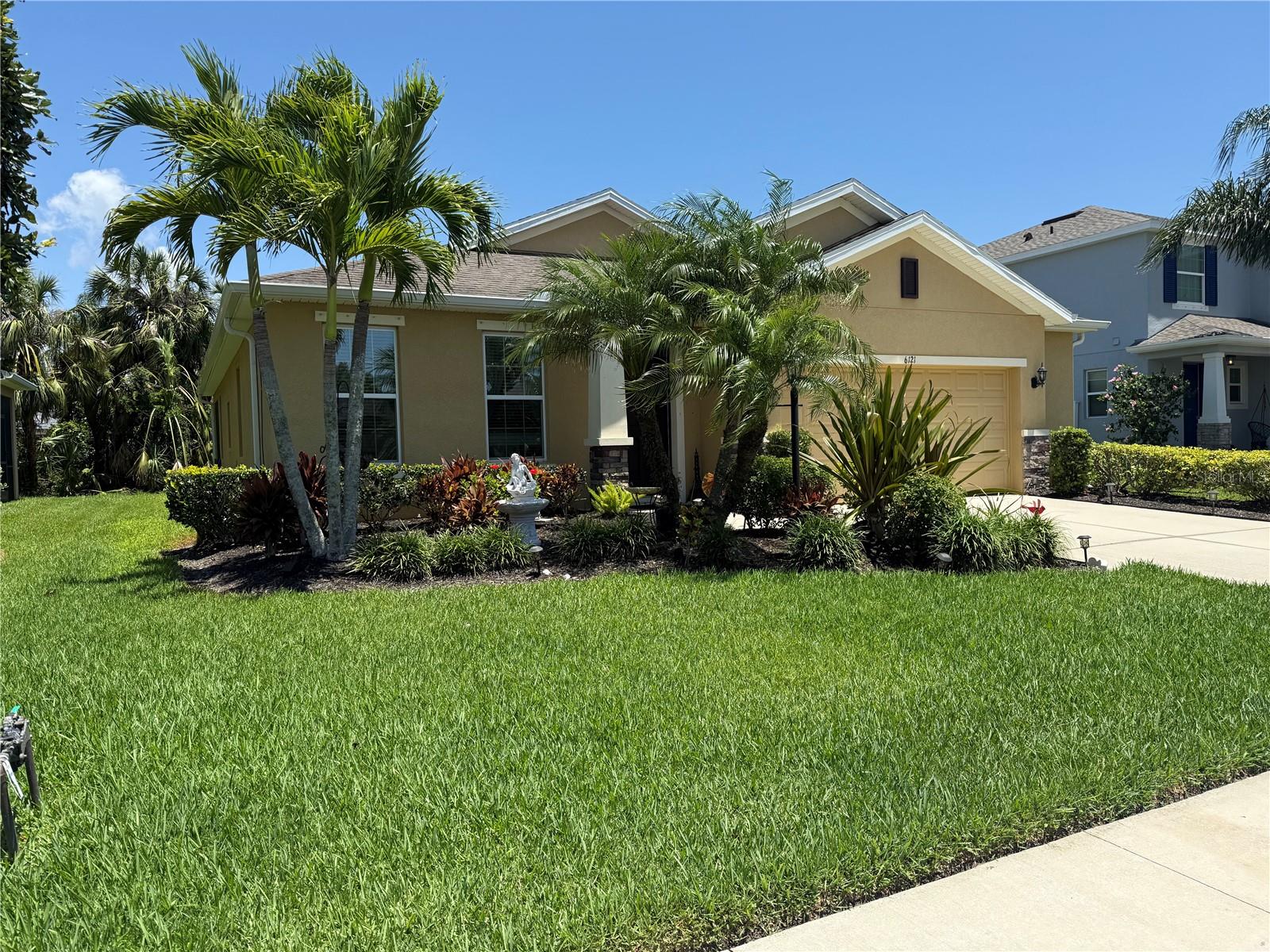 Experience refined Florida living at 6121 35th Ct E, Bradenton, FL — a stylish retreat tucked at the end of a quiet cul-de-sac in one of Bradenton’s most convenient pockets. This beautifully cared-for home greets you with soaring ceilings, abundant natural light, and an open-concept layout designed for both comfort and entertaining. The kitchen offers generous counter space and a seamless connection to the main living areas, creating a natural gathering spot. Step out to the screened lanai and take in serene views of mature trees and lush greenery — a perfect backdrop for morning coffee or evening wine. The split-bedroom design ensures privacy, with a spacious primary suite offering a peaceful escape. With charming curb appeal, a two-car garage, and close proximity to University Town Center (UTC) where you can shop and dine and also enjoy the Gulf Coast beaches, this home strikes the perfect balance of tranquility and accessibility. It’s move-in ready and waiting to elevate your lifestyle.