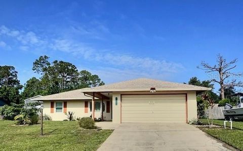 Photo of 520 Jupiter Boulevard NW, Palm Bay, FL 32907 (MLS # O6324922)