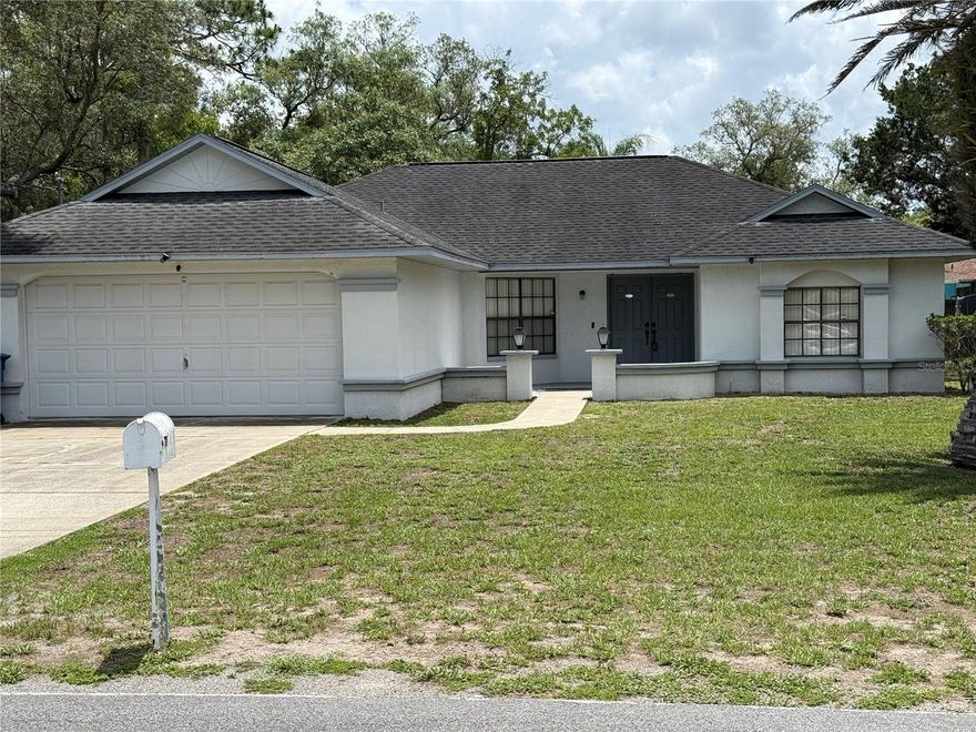 Solid block construction home with NO HOA and NO CDD fees. At 1,498 sq ft, this 2-bedroom, 2-bath layout includes a 2-car garage, a bonus room that can be used as an office/den or converted to a third bedroom.  The backyard is partially fenced adding privacy and pet-friendly appeal.  The screened lanai with trees creating a shaded oasis. Cosmetic updates will unlock instant equity. Bring your vision and your contractor — the upside here is real. Spring Hill continues to draw seasonal visitors, short and long-term renters, with Gulf beaches, Weeki Wachee Springs, top medical facilities, and a robust shopping corridor all just minutes away. Solid structure, flexible floor plan, zero association fees — this is the value-add opportunity you've been waiting for.