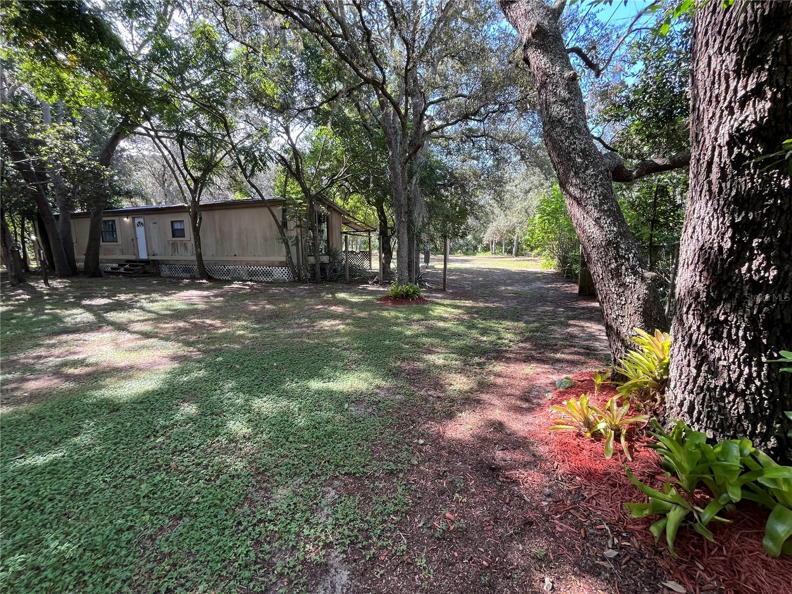 Welcome to your peaceful retreat! This single wide manufactured home sits on a beautiful 1-acre lot, offering the perfect blend of privacy, space, and freedom—with no HOA restrictions. Surrounded by open skies and natural beauty, this property is ideal for those looking to enjoy a quiet lifestyle or create their own mini homestead. Whether you're gardening, relaxing under the stars, or simply enjoying the view, this land offers endless potential. The home features two bedrooms, 1 1/2 bathrooms, a functional layout, and all the essentials you need for comfortable living. Electric / Water / Septic on property.