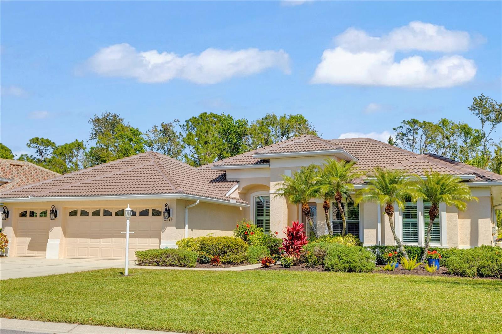 Tucked away in the exclusive gated enclave of Edgewater Village, just moments from the bustling charm of Lakewood Ranch Main Street and a block from the serene marina, this stunning 4-bedroom, 3-bathroom estate with a private den by Lee Wetherington is the epitome of luxury, tranquility, and modern convenience. Set on a premium preserve lot with captivating sunrise views, the home is perfectly positioned to embrace Florida’s natural beauty. Mornings begin with the golden glow of dawn reflecting over the resort-style pool and spa, creating a serene retreat for coffee, yoga, or a refreshing swim. The newly designed pavered lanai and pool deck provide the ideal setting for elegant outdoor entertaining or quiet evenings under the stars, all framed by lush, undisturbed preserve views. Inside, the home’s soaring ceilings, custom architectural details, and sun-drenched interiors create an inviting yet sophisticated atmosphere. Designed for both comfort and functionality, this spacious layout features four well-appointed bedrooms, three full baths, and a private den, perfect for a home office or flex space. Thoughtfully upgraded with a new roof (2024), new A/C (2024), premium interior paint (2024), brand-new kitchen appliances (2024), a new water softener (2024), designer kitchen backsplash (2025), and hurricane-rated windows and doors (2025), this home offers both style and peace of mind. Beyond the residence, experience an unmatched lifestyle in one of Florida’s most sought-after communities. Enjoy championship golf courses, premier tennis and pickleball courts, over 150 miles of scenic trails, vibrant social clubs, top-rated schools, and pristine parks. With downtown Sarasota’s culture and dining just 30 minutes away and the world-famous Gulf beaches only 12 miles from your doorstep, this exceptional estate is a rare opportunity to enjoy luxury, privacy, and an effortless Florida lifestyle—all with low HOA fees.