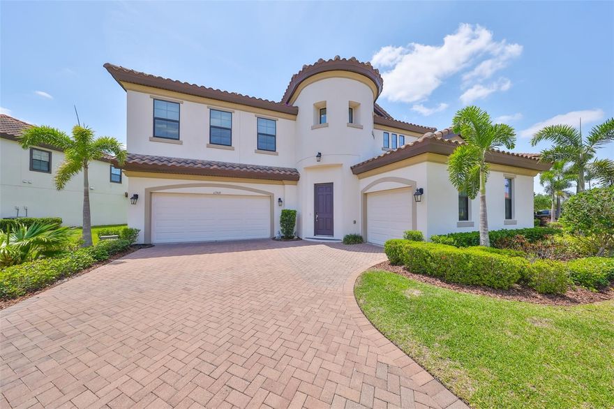Look no further!! Your executive dream home awaits and nestled on a premium lot in the exquisite gated community of Waterleaf. This 4200 sqft plus home features 5 bedrooms, 4.5 bathrooms, 3 car garage. This Madeira model presented by Homes by West Bay offers luxury and elegance with many upgrades to enhance any lifestyle.  As you enter the home and step into the soaring foyer you will notice a private home office, formal dining room, and  expansive gathering area where comprised of the great room, gourmet kitchen and casual dining. The kitchen is a chef's dream with ample storage, and a center island perfect for meal preparation and hosting. This amazing entertainment hub provides views of the pond and expansive backyard from many vantage points. Tucked in the back on the main floor is a private bedroom to use as a guest room, in-law suite or home gym; the possibilities are endless. The backyard has a beautiful view of the pond and offers a peaceful ambiance, perfect for relaxing and taking in all that nature has to offer; watching the sunrise and sunsets.  The second floor features a large bonus room splitting the primary bedroom from the the additional bedrooms which are generously sized and provide plenty of space for family members or guests. Also found upstairs for convenience, is the oversized laundry room and extended balcony to enjoy the beautiful water views. Upon entering the owners' retreat, you will enjoy a luxurious ensuite, with dual split vanities, separate shower and tub as well as expansive walk in closets. Additionally, take in the great views from your private balcony overlooking the pond. This home has it all; luxury, energy efficiency, style and space. The homeowner association fee covers Spectrum UltraFi WiFi (500 mb) as well as extended basic cable, including Showtime. This residence is conveniently located only 30 minutes from Downtown Tampa, MacDill, Sarasota, award winning beaches, top rated schools, shopping, dining, medical facilities, and major highways. The Waterleaf community  offers a resort-style pool, a clubhouse, bike and walking trails, dog park and a sports court, enhancing the overall living experience.  Don't delay on scheduling your private tour today and say yes to the address!