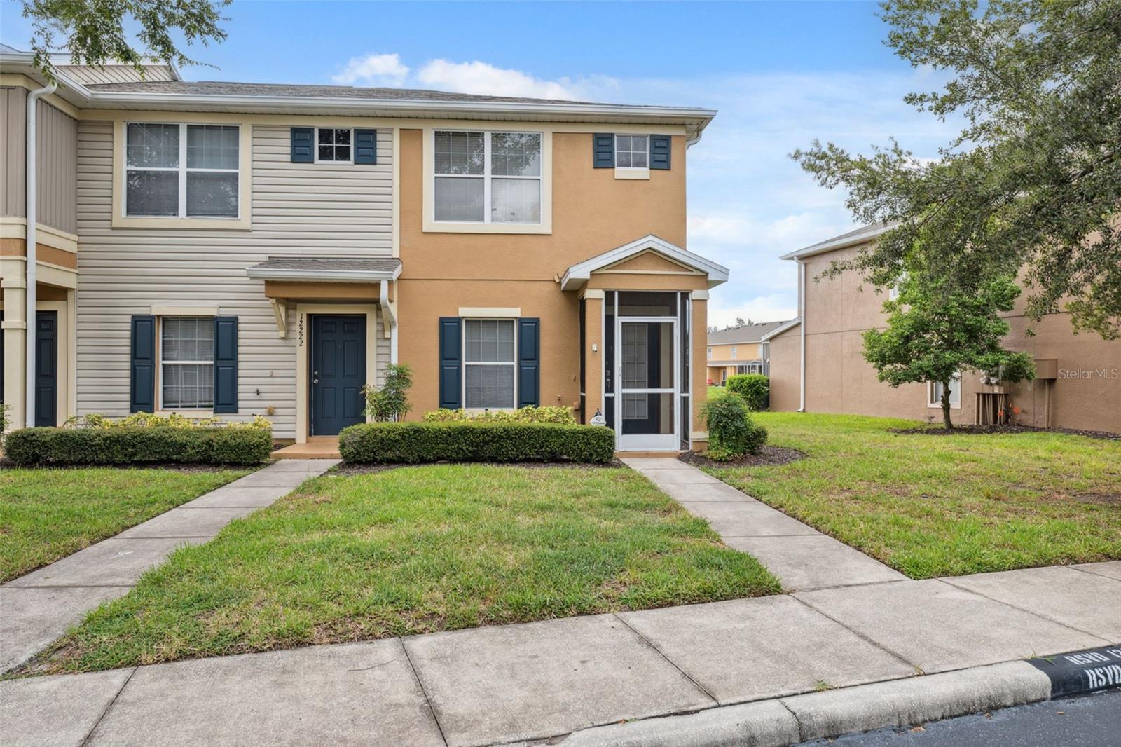 Welcome Home to Panther Trace Living! Step into this beautifully maintained end-unit townhome nestled in the desirable Panther Trace community, offering both comfort and style. Enjoy serene pond views from your expansive tiled and screened lanai, perfect for relaxing or entertaining outdoors. This spacious 2-bedroom, 2 full and 2 half-bath home features numerous upgrades, including brand new interior and exterior paint, stylish accent walls in the living area and primary bedroom, and new flooring throughout. The kitchen is generously sized with stainless steel appliances, recessed lighting, a walk-in pantry, and additional storage under the stairs. The upstairs layout offers privacy and comfort, with two large bedrooms, each with their own ensuite bathroom. The primary suite features his and her closets and overlooks peaceful pond views. Other recent upgrades include a 2020 roof and a 16 SEER AC system (installed in 2019) equipped with UV lights in the ducts and coils for enhanced air quality. Located just minutes from shopping, dining, and entertainment, this home combines convenience with modern living in a well-kept community. Don’t miss your chance to make this one yours!