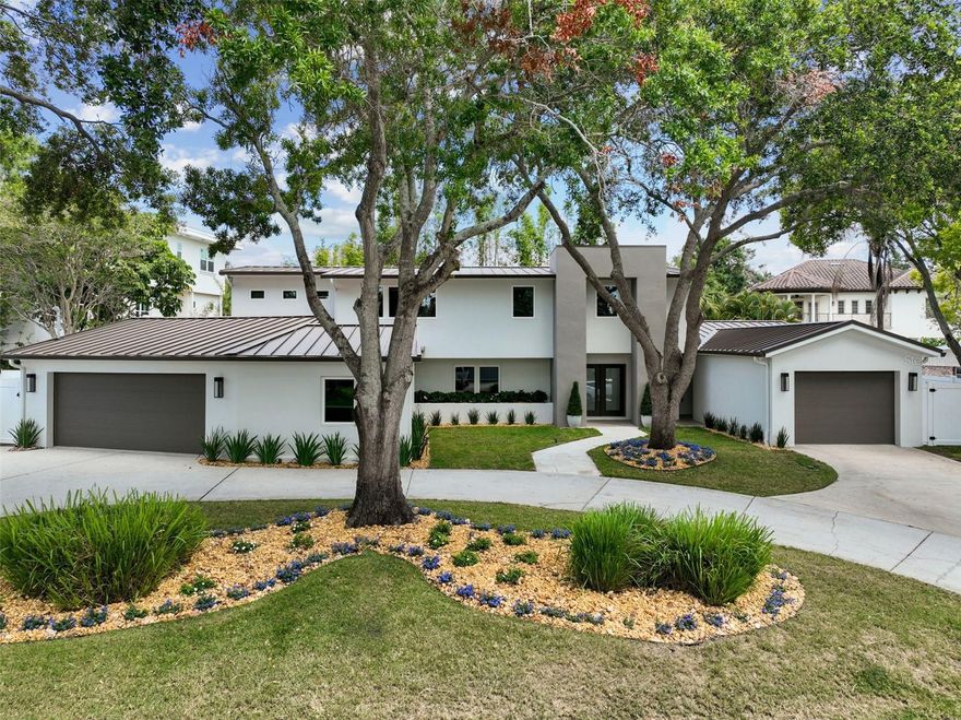 Breathtaking modern architectural design & renovation in 2015/2016 by Thomas E. Lamb. Located on one of the most sought-after streets in Beach Park. Sandpiper Rd is lined with magnificent multi-million-dollar homes nestled on a secluded circular road with only one access street surrounded by the beautiful water of old Tampa Bay. Extensive renovations include a new metal roof, stucco siding, new appliances, plumbing, electrical, gutters, pool, additional garage & square footage added. Featuring 5 bedrooms, a large flexible study/den space with a separate entrance, 4 full baths, and a 1/2 pool bath. The open kitchen concept has a large quartz island with seating, Thermador appliances, custom built-in cabinets galore, and a walk-in pantry. Eat-in kitchen dining area overlooks the oversized heated pool with jacuzzi and can be controlled by phone application. Coral stone pavers cover the pool/lanai, equipped with a patio gas stub-out ready for an outdoor kitchen and a perfect backyard entertaining space. 1st floor in-law/nanny suite with en-suite bathroom & walk-in closet has a sliding door to the pool area and gives access as a private entry. 2023 updates include a complete exterior landscape, landscape lighting, a new fence, freshly painted inside and out, and new patio fans. This 0.2893-acre lot (100 X 126) includes 2 car garage plus a stand-alone single-car garage connected by a covered breezeway. Massive circular driveway with mature trees offers plenty of shade with lots of space for parking. Many extras included – 3 TVs linked into home automation system, Crestron Automation System (50k) was added in 2019: with IR security cameras, smart TV control/Apple TV, home audio in-door and outdoor system with Sonos speakers, climate control, garage control, and door monitoring system, with the capabilities for lighting control add on. Remotes for Crestron system: the system works seamlessly from any cell phone via APP, brand new hard-wired Tesla charger. Mud room has a Liberty safe bolted into the floor. Sandpiper Rd features some of the most expensive recent home sales in the Tampa area and is centrally located within minutes of Interstate 275, the Veterans Expressway, Tampa international airport, Westshore & International Shopping Mall, sports venues, many fabulous restaurants, and in one of the most desired school zones including Plant High school. This home is not a SPEC home and the owners spared no expense on the upgrades and upkeep of the property.