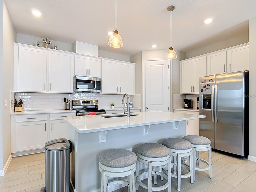 Photo of 1525 Erin Breeze Lane, Kissimmee, FL 34744 (MLS # O6438881)