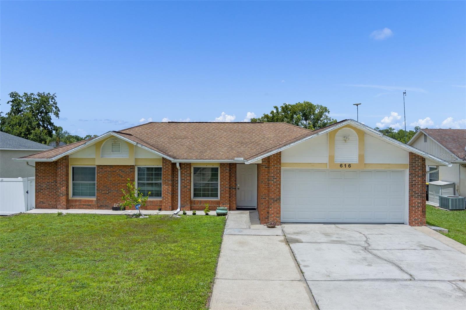 Welcome to this charming 3-bedroom, 2-bathroom home nestled in the heart of Poinciana Village. Inside, you'll find a spacious and open living area filled with natural light—perfect for gathering with family or hosting friends. The kitchen is equipped with stainless steel appliances, plenty of cabinet space, a pantry, and a cozy eat-in dining area that overlooks the backyard, making it both functional and inviting. Step outside to a screened-in, covered back porch with tiled flooring and ceiling fans, ideal for relaxing or enjoying outdoor meals. The extended patio and vinyl-fenced backyard offer additional space for entertaining or unwinding in privacy. Located in a quiet neighborhood, this home is part of a vibrant community with amenities including a fitness center, pool, park, playground, and tennis courts. HOA dues cover basic cable and WiFi for added convenience. All of this just a short drive from Orlando’s world-famous attractions, shopping, and dining—don’t miss your opportunity to call this home!