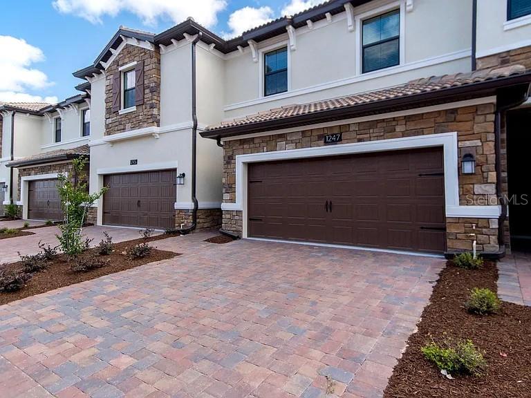 Discover this beautiful townhome features three spacious bedrooms, plus two and one-half bathrooms. It is facing a quiet scenic green space view from the back and a jogging trail. The covered entry leads into an elegant dining room which connects to a spacious great room which overlooks the kitchen. Just minutes from Walt Disney World and Orlando’s top attractions, this home offers the perfect blend of luxury and convenience. This home is located in the Vistas lake, at Champions Gate! It includes the access to a first class amenities center, pool, spa all just steps away as well as the Omni Hotel golf course. Shopping is minutes away in downtown Champions Gate. The Trails at the Vistas! Located very close to The Omni's Golf Club. Minutes away from Walt Disney World, the Omni Hotel and Resort, International Drive, and I-4, where residents and visitors of the Vistas can play, eat and shop all within minutes from their doorstep. The Vistas at Champions Gate provides limitless fun and enjoyment for anyone looking to take a break from life and Live Like a Champion! This home ready for you and your family. Schedule your showing today!