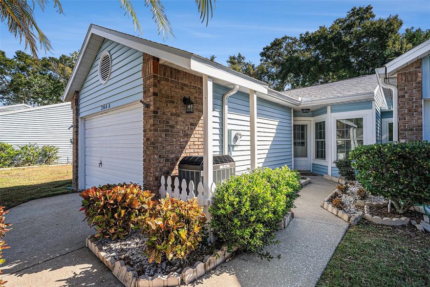 Welcome to this affordable 2BR/2BA end-unit villa! Enjoy open living, a screened porch, 1-car garage, and great community amenities—2 pools, low HOA, and no age limits. Newer roof 2021, AC 2020 , and water heater 2020 make this home a worry-free gem!