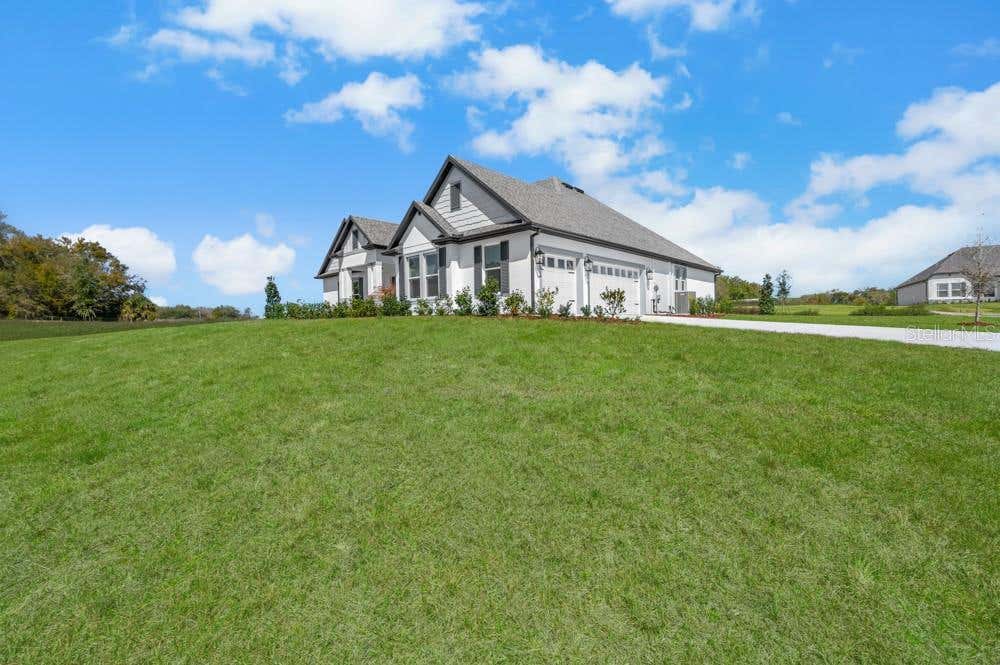 Photo of 3841 Saddle Hill Trail, Fruitland Park, FL 34731 (MLS # TB8535540)