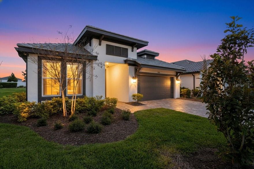 Nearly new 2023 pool home in Sweetwater at Lakewood Ranch featuring a heated saltwater pool/spa, private rear setting, and guest suite with ensuite bath. Built by M/I Homes, this beautifully upgraded Calusa floor plan offers 4 bedrooms, 3 bathrooms, and modern open-concept living designed for comfort and entertaining. Perfectly positioned on a premium lot with additional space behind the pool, the home provides added privacy and a peaceful outdoor setting. Inside, you’ll find tray ceilings, porcelain tile flooring throughout (no carpet), and ceiling fans in every room. The gourmet kitchen showcases a large quartz island, stainless steel appliances, natural gas range, soft-close cabinetry and drawers, and a stylish tile backsplash. The spacious primary suite offers dual vanities, a walk-in shower, and a generous walk-in closet, while bedroom 4 features its own ensuite bathroom, ideal for guests or multigenerational living. Step outside to your private outdoor oasis with a heated saltwater pool and spa with smart app controls, heated by natural gas for quick and efficient warming. The oversized screened lanai with expansive paver decking and outdoor TV setup creates the perfect space for relaxing or entertaining. Additional highlights include an irrigation system using reclaimed water for eco-friendly lawn care, and the HOA includes yard maintenance for a low-maintenance lifestyle. Residents of Sweetwater at Lakewood Ranch enjoy resort-style amenities including a clubhouse, fitness center, resort-style pool, pickleball and basketball courts, festival lawn, and amphitheater, all conveniently located near top-rated schools, shopping, dining, and the world-renowned Gulf Coast beaches.