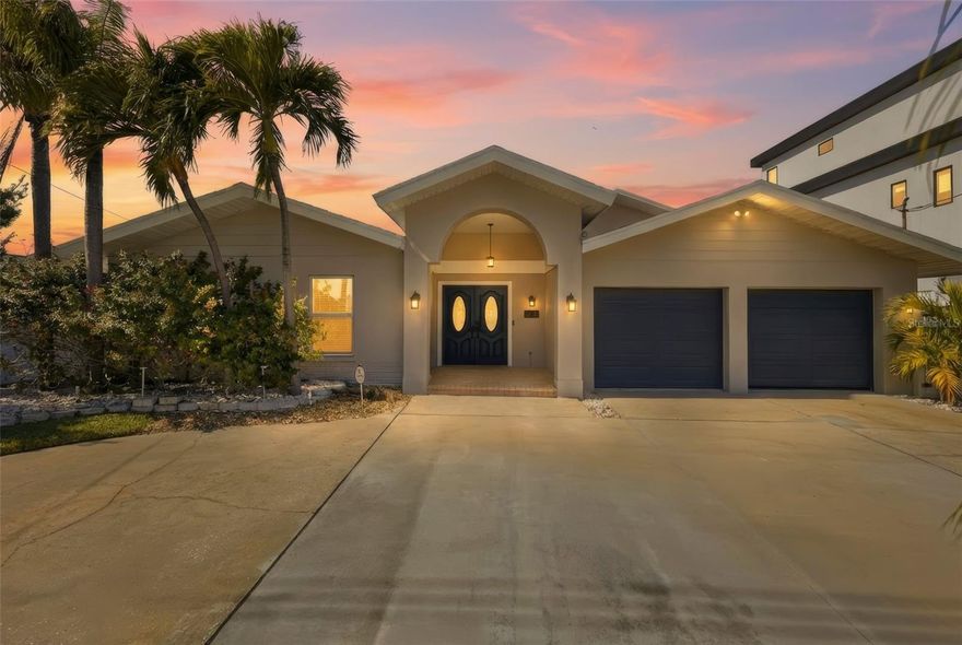 Located in historic Pass-a-Grille on desirable Vina Del Mar Island, this beautifully updated custom waterfront home offers the ultimate Florida coastal lifestyle. Just a short three block walk to the world famous Pass-a-Grille Beach with its soft sugar sand and breathtaking sunsets, the location is simply unmatched.
Boaters will appreciate the deep-water channel that accommodates larger vessels , offering protected access to the Gulf of Mexico while enjoying a quiet, low-traffic section of the waterway. The property features a new dock with fishing and paddleboard landing or Jetski parking, plus a 10,000 lb boat lift.

Designed for both relaxation and entertaining, the home has a true resort feel with a heated PebbleTec pool, built-in spa, and spacious patio area. A circular driveway and oversized two-car garage provide ample guest parking.

Inside, picturesque waterfront views greet you upon entry. The first floor offers three bedrooms and three baths, including a potential primary suite with en-suite bath and walk-in closet. French doors and plantation shutters enhance the modern coastal design. The large family room with custom built-ins is ideal for gatherings, and the bright chef’s kitchen features new appliances, granite countertops, abundant storage, and an adjacent laundry room.

Upstairs, the expansive primary suite captures stunning waterfront views and includes a luxurious en-suite bath, sitting area, generous walk-in closets, and a wrap-around balcony perfect for enjoying the coastal breeze.
Enjoy walking, biking, or riding your golf cart through this charming neighborhood to nearby parks featuring tennis courts, basketball, playground, and dog park. Local waterfront dining is just minutes away, while vibrant downtown St. Petersburg is easily accessible. Convenient access to Interstate 275 makes commuting effortless, and both Tampa International Airport and St. Pete–Clearwater International Airport are within easy reach.

A rare opportunity to own a waterfront treasure in one of Florida’s most sought after beach communities.