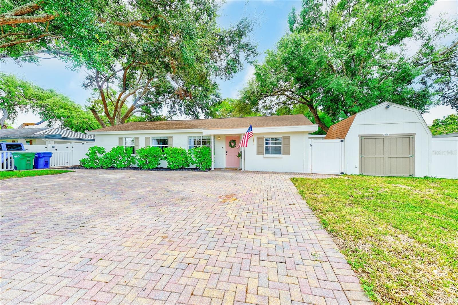 Tucked away in the heart of South Tampa and not located in a flood zone, this versatile 4-bedroom, 2-bath home offers peace of mind, comfort, and a location that’s hard to beat. The property has never experienced any flooding or damage from recent hurricanes or storms, making it a solid choice for buyers seeking both style and stability.
With 1,464 square feet of well-designed living space, the home features luxury vinyl flooring throughout the main living areas, tile in the dining room and fourth bedroom (ideal as a home office), and a spacious primary suite with a large closet and private bath featuring a tiled shower. The updated guest bath includes a sleek floating vanity, while fresh interior and exterior paint give the home a crisp, move-in-ready feel.
A large sunroom off the back of the home flows out to the fully fenced backyard—perfect for entertaining or relaxing—with ample space to add a pool. The wide paver driveway easily fits four vehicles, and two separate sheds offer bonus space, including one that’s been converted into a studio-style guest retreat with laminate floors, a Murphy bed, and wall AC—ideal for visitors, hobbies, or creative space.
Updates include a new HVAC system (2023) and a tankless water heater (2018). The roof, replaced in 2013, is in good condition with no current issues, and the seller is open to providing a credit or replacement due to its age with acceptable offer.
Just 5 minutes from MacDill AFB, less than 10 minutes to downtown Tampa and Bayshore Boulevard, and under 20 minutes to downtown St. Pete via the Gandy Bridge—this location can’t be beat. Enjoy beaches within 30 minutes, plus easy access to top-notch dining, sports, concerts, and cultural venues throughout Tampa Bay.
This South Tampa gem delivers the comfort, flexibility, and lifestyle you've been searching for.