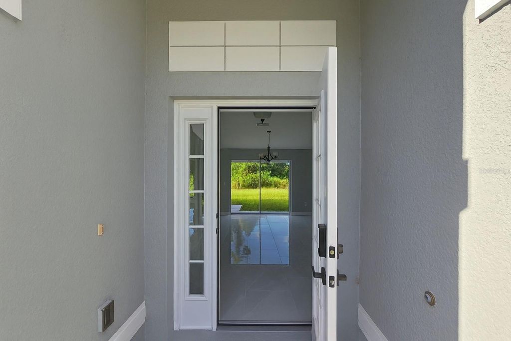 Photo of 116 Ridgemont Drive, Lehigh Acres, FL 33972 (MLS # C7516531)