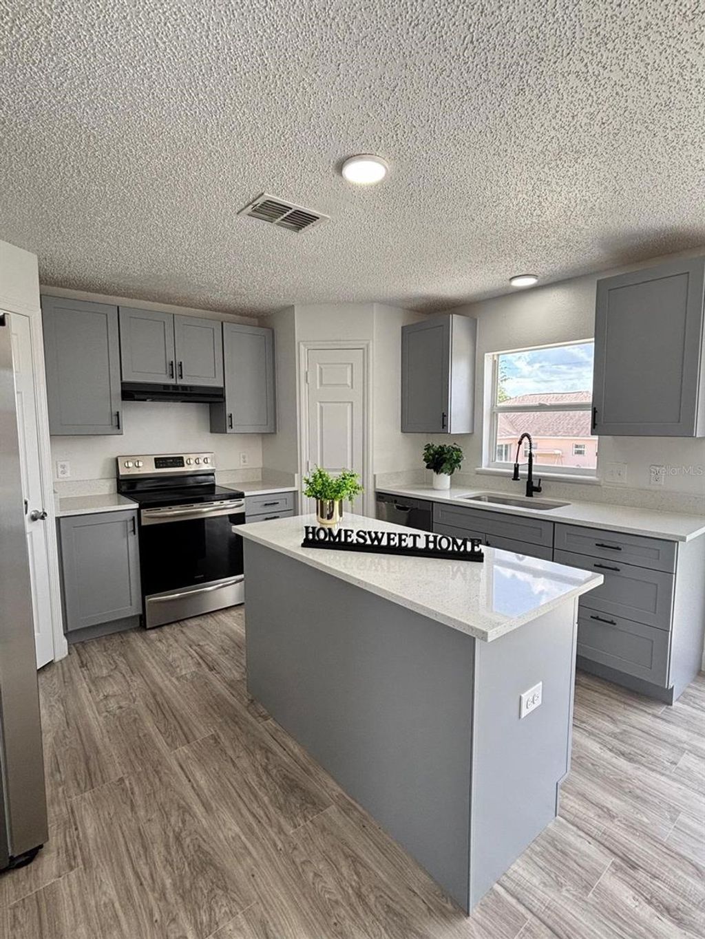 Photo of 404 Manitoba Drive, Kissimmee, FL 34759 (MLS # S5151018)