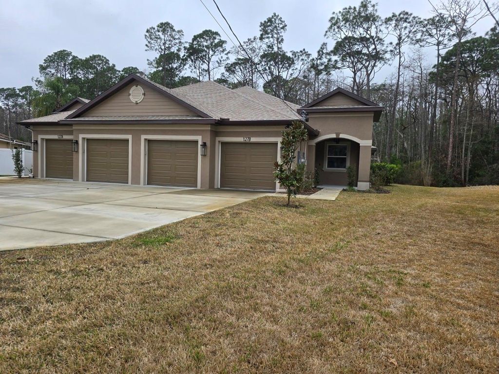 Photo of 127 Ullian Trail #B, Palm Coast, FL 32164 (MLS # FC316252)