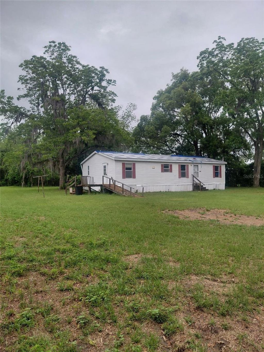 Photo of 1289 SW Bedenbaugh Lane, Lake City, FL 32025 (MLS # O6404067)