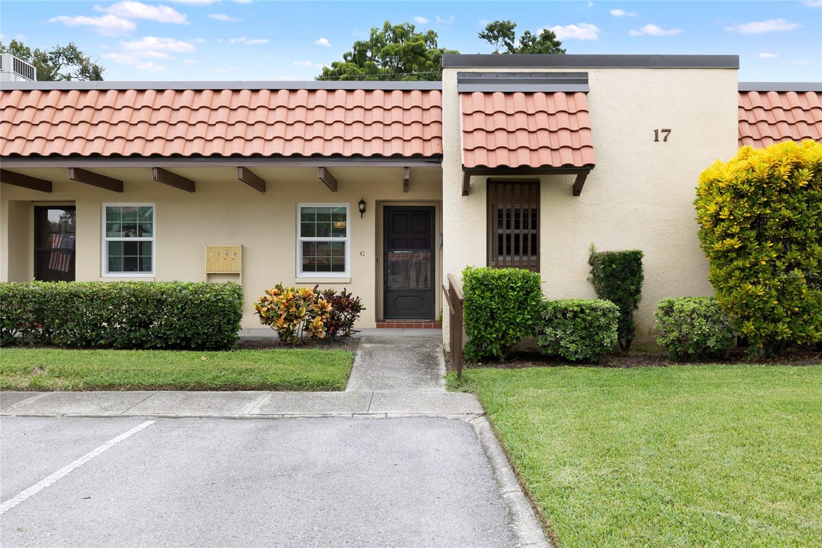 Welcome to your remodeled 2-bedroom, 1.5-bath villa in the sought-after 55+ community of Pinehurst Village, ideally located just 1.5 miles from vibrant downtown Dunedin and 4 miles from the sugar sands of Honeymoon Island State Park. This residence has been stylishly updated with crown molding, 5" baseboards, and luxury vinyl plank flooring throughout. The kitchen dazzles with quartz countertops, stainless steel appliances, white cabinetry, a subway tile backsplash, and a custom pantry, while both bathrooms feature custom vanities, including a spa-inspired walk-in shower with dual shower heads in the main bath. Plantation shutters and remote-controlled shades dress every window, and the split-bedroom plan enhances privacy. A convenient washer and dryer are located inside the unit, and the home’s position along the south perimeter wall means no rear neighbors, offering peaceful surroundings and extra privacy rarely found in condo living. Recent upgrades include HVAC (2021), updated electrical panel (2020), and a roof replaced by the association in 2023. An assigned covered carport and ample guest parking add to the ease of living. The clubhouse, heated pool, shuffleboard courts, and picnic area are just steps away. Pinehurst Village is celebrated for its lush grounds, active social calendar, and wide-ranging amenities, while monthly maintenance covers nearly everything including water, sewer, trash, exterior maintenance, lawn care, cable, internet, and escrow reserves, making life feel virtually maintenance free. With nearby festivals, restaurants, breweries, boutiques, golf courses, the Pinellas Trail, and TD Ballpark for Blue Jays spring training, this villa invites you to embrace the very best of the Florida lifestyle, whether year-round or seasonal. Reach out to book a showing!