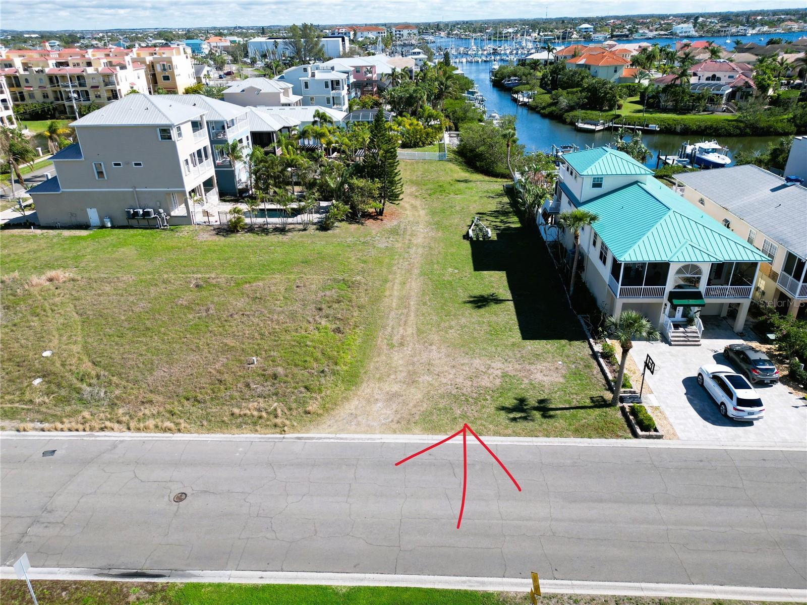 Build the coastal home of your dreams on this rare waterfront lot at 6435 Marbella Blvd, Apollo Beach, FL 33572! With stunning views of Tampa Bay from the front and canal and marina views from the rear, this lot offers an unbeatable location for breathtaking sunsets, dolphin sightings, and endless water activities.
With no CDD or HOA restrictions, you have the freedom to design and build your ideal home without limitations. Whether you enjoy boating, fishing, or kayaking, this location is perfect for embracing the waterfront lifestyle.
Conveniently located near Lands End Marina, Apollo Beach Nature Preserve, and popular waterfront restaurants like Circles and Finns, this property places you at the heart of coastal living. Plus, with easy access to major highways, Downtown Tampa, St. Petersburg, and the pristine Gulf beaches, you're never far from shopping, dining, and entertainment.
Don't miss this rare opportunity to create your private paradise in a prime location. Start building your dream today!