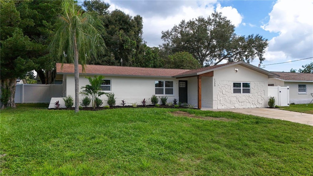 Photo of 1255 E Lazy Lake Road, Dunedin, FL 34698 (MLS # TB8552475)