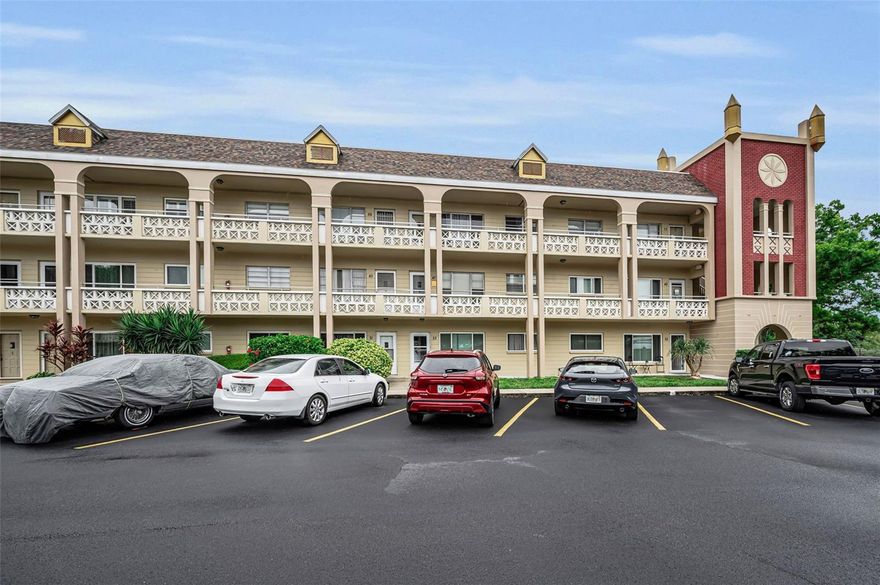 Looking for bright, carefree Florida living? This 1,100 sq ft FIRST FLOOR END-UNIT, 2-bed, 2-bath condo in Clearwater shines with natural light from extra windows. Where in the World?  On Top of the World, Eastside, Bohemia Building, #25.  Need convenience? Your assigned parking leads to a brand new front COVERED concrete porch (18X5). Inside, enjoy a legal in-unit WASHER/DRYER, solid wooden kitchen cabinets with Corian countertops and tile backsplash, dishwasher, freshly painted interior ceiling/walls, and a large bonus room opening to a lusciously landscaped COVERED LANAI (17x10) with fresh Bear Granite Grip concrete paint. Crystal clear newer front windows are double pane and the rear windows are double hung. Mechanics?  2021 AC and newer HWH for peace of mind. Pet lover? Large dogs are welcome here offering a dog park to boot.  Want endless activities? Enjoy 170 clubs—fitness classes, swimming with 2 pools to choose from, dancing, cards, billiards, entertainment, and educational classes. Did someone say FREE GOLF?  YES!!!!  Residents enjoy free golf from an 18 hole or a 9 hole course!!!  Curious Traveler?  Yes, join the travel club and go see the WORLD!  Food Available?  The on-site Good Karma Café offers convenient take-and-bake meals.  Need extra storage?  Check!  Every resident has a storage spot in the building's storage closet.  What attractions are you near? Clearwater’s stunning beaches, top dining, shopping, and entertainment are just minutes away, making this vibrant 55+ community the perfect spot to call home!  Association approval and 35% down if financing. Your Clearwater lifestyle awaits—schedule a showing today!