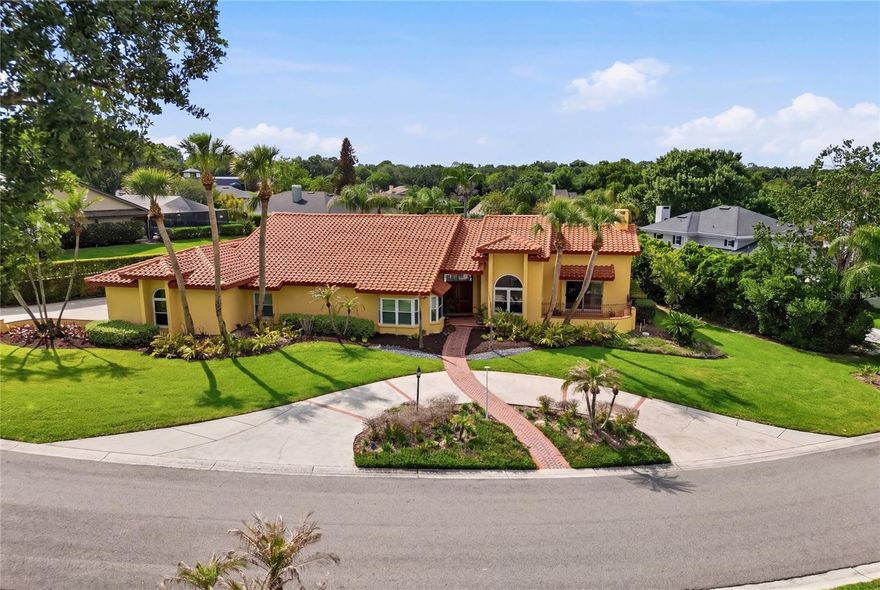 Welcome to a rare opportunity in the gated Pier Point community! This thoughtfully updated, single-story pool home offers a refined balance of space, privacy, and high-end functionality, all just steps from Scott Lake with both lake access and a view of the water from the property. The expansive screened lanai and private pool create a true indoor-outdoor lifestyle, with a large covered entertaining area, outdoor wet bar setup, and a deep pool design ideal for both relaxing and entertaining. The kitchen features solid wood cabinetry, stone countertops, and thoughtful custom storage solutions including pull-out pantry systems and built-in appliance functionality, blending durability, craftsmanship, and everyday usability. A collection of thoughtful, high-value upgrades sets this home apart, including custom wine storage capable of storing nearly 300 bottles, California closet systems, a beverage center, EV charging station, and instant hot water at the kitchen sink. Significant capital improvements have already been completed, including new windows (2021), updated flooring (2021), renovated bathrooms (2021), interior and exterior paint (2025), updated lighting, and a roof replacement (2018), providing peace of mind and move-in-ready convenience. The home also features a circular driveway along with a side-entry 3-car garage, offering both strong curb appeal and exceptional parking flexibility.  With its combination of location, upgrades, functionality, and lifestyle features, this home stands out as one of the most complete and well-positioned properties currently available in South Lakeland.