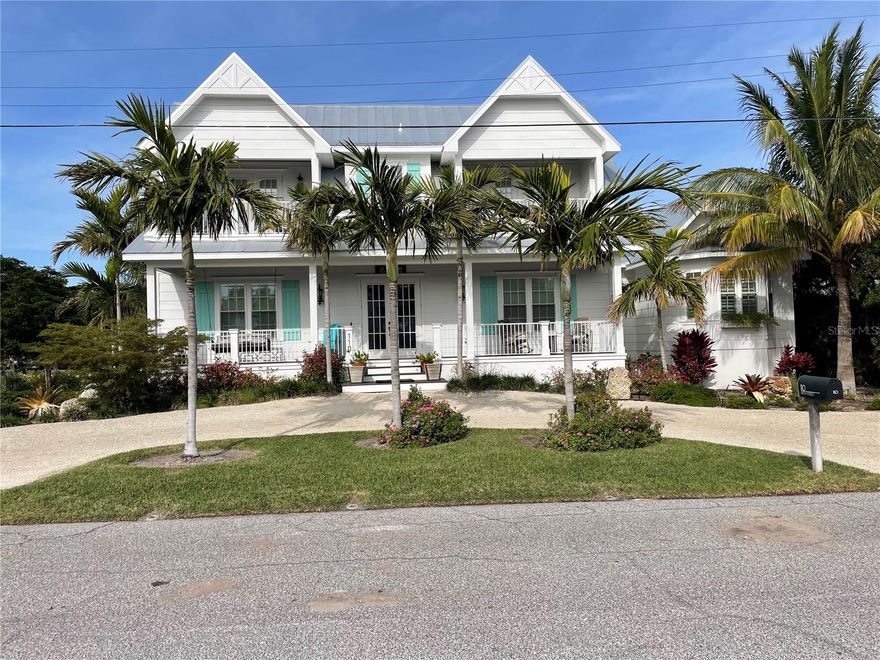 Stunning home just steps to the beach with gorgeous views of the Gulf and Bay!  This 4BD/4.5BA luxury home has it all and comes turnkey furnished - just pack your bags!  Features include 2 primary suites, elevator, Wolf and Sub-Zero appliances, quartz countertops, smart-home technology, high end finishes, upgraded tile flooring, extensive trim work, heated pool/spa, rooftop deck/multiple covered patios, and so much more.  Located on a large corner lot and allows for weekly rentals.  Luxury living at its finest!