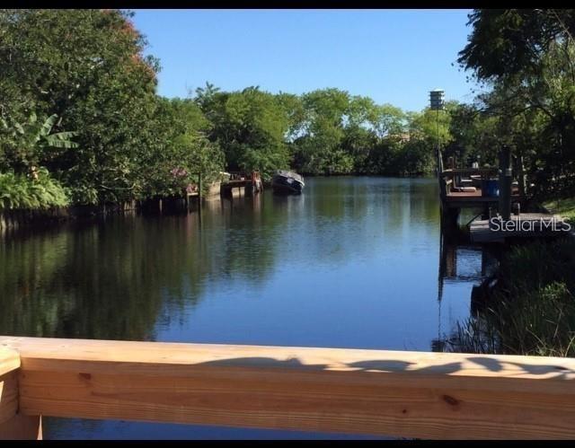 Embrace the quintessential Floridian lifestyle with this charming traditional home nestled on the tranquil banks of a saltwater canal in North Port, FL. Presenting 6540 Marius Rd, a delightful two-bedroom, one-bathroom residence that's perfectly suited for homeowners and investors alike who crave a serene waterfront retreat. This almost a 1/4 acre property offers a unique opportunity to dock your watercraft at your private recently renovated boat deck, complete with power & water and indulge in watching manatees and breathtaking sunsets or take a leisurely 45-minute boat ride out to the Port Charlotte Bay. This home has a concrete seawall! This home has never flooded! Step inside to an open concept dining and living room, accented by a Florida room that boasts a stunning 10-foot sliding glass door with new rollers, framing the panoramic vistas of the canal. The house features all tile floors for easy maintenance and two screened lanais that provide ample space for relaxing or entertaining guests against the backdrop of the gorgeous Florida evenings. The home features a Metal roof 2006, a water heater 2020, the outside air was replaced in 2024. Home is move in ready! The traditional kitchen is equipped with a dishwasher, stove, and refrigerator, alongside plentiful cabinets for storage. Both bedrooms are generously sized, and the bathroom exudes classic Southwest Florida charm, complete with heron etched shower doors set against vibrant SOUTHWEST traditional pink tile and lime green paint. You'll also appreciate the convenience of an attached covered carport, a laundry room complete with washer and dryer, and additional storage space in the lanai. With no HOA to worry about, this property grants you the freedom to truly make it your own. Park your Boat, Trailer or water toys in the side yard. Located in one of the top 10 fastest-growing cities in Florida, 6540 Marius Rd is minutes away from Warm Mineral Springs where the movie stars came to get in the mineral rich springs and believe it had healing powers. There is plentiful shopping, airports, and major highways like I-75.