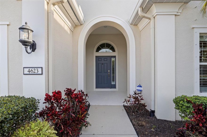 Welcome to this beautifully upgraded home in the highly sought-after Central Park/Claremont Park Maintenance Included private gated community, where refined style meets modern convenience. Designed with an open-concept floor plan, this residence offers seamless flow between the living room, dining area, and kitchen, enhanced by recessed lighting that creates a bright and inviting space ideal for both everyday living and entertaining. The kitchen is thoughtfully designed with rich espresso cabinetry, granite countertops, stainless steel appliances, and a center island with breakfast bar seating perfect for casual dining and gathering. Tile and laminate flooring flow seamlessly throughout the home, complemented by numerous upgraded finishes that enhance both style and functionality. This well-designed residence features two bedrooms plus a versatile office or den, ideal for remote work, guest accommodations, or a flexible living space. The primary suite offers a sleek en-suite bath complete with a walk-in shower. The Primary Bedroom is enhanced with a custom built walk-in closet with added storage and organization and the second bedroom has a closet with custom built ins with organization. Step outside to a spacious screened lanai surrounded by mature landscaping providing privacy and a peaceful setting to relax or entertain year-round. Additional highlights include a new A/C system (2023), water heater (2022), a spacious laundry room with storage cabinetry. The garage features include polyaspartic flooring, a Level 2 EV charger, and extensive storage cabinetry and shelving providing exceptional organization and functionality. Residents of Central Park can enjoy access to a wide range of amenities, including two dog parks, tennis courts, a baseball field, a community pool (Claremont park residences only), and more all conveniently located near shopping, dining, and top-rated schools. Experience low-maintenance living in one of the area’s most desirable communities.