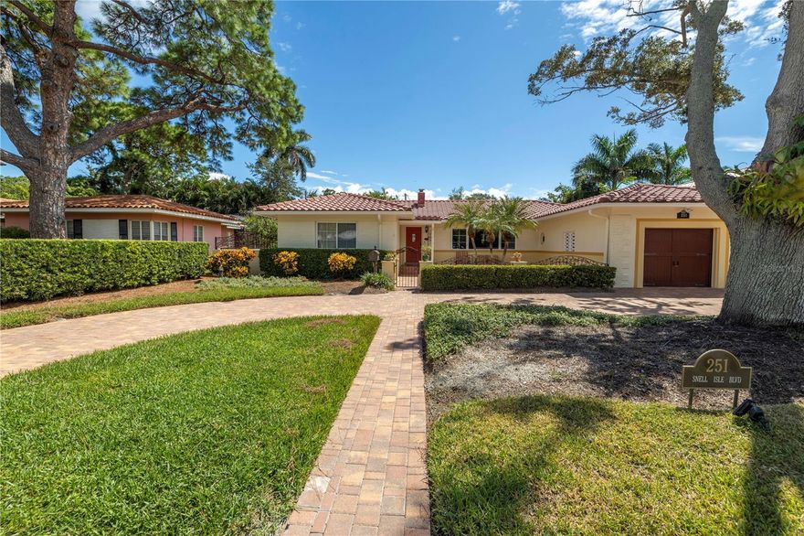 SUNDAY, Nov 26th OPEN HOUSE CANCELED DUE TO WEATHER. ACCEPTING BACKUPS. Built in 1951 this Snell Isle Classic is just what you would expect for a 1950's Spanish Mediterranean style home....with a charming front courtyard to a lovely pergola covered patio out back. It features traditional tile roof, wood flooring throughout most of the home, tile in kitchen, bath and sunroom/Florida room. French doors lead to the sunroom and another set of French doors open to the outside patio. Living room has a wood burning fireplace, formal dining room and spacious bedrooms with lots of windows. You will love the charm and grace of the Snell Isle community. Washer, dryer and half bath are located in the garage.